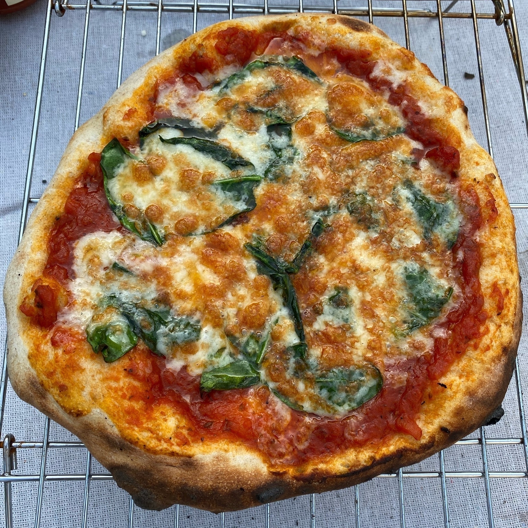 Small pizza on a cooling rack