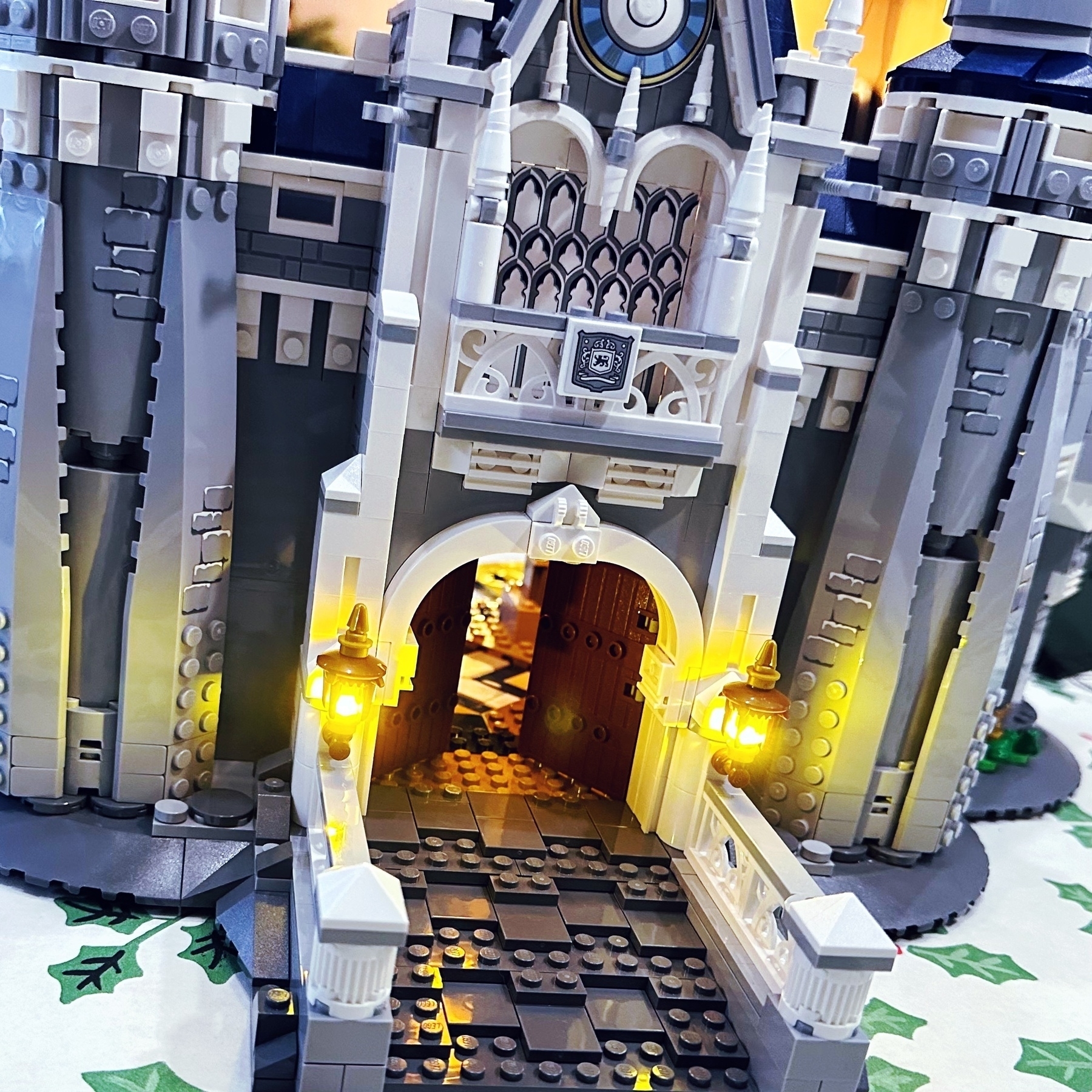 photo of the disney lego castle showing the enterance gate with the two gas lamps wired to led lights