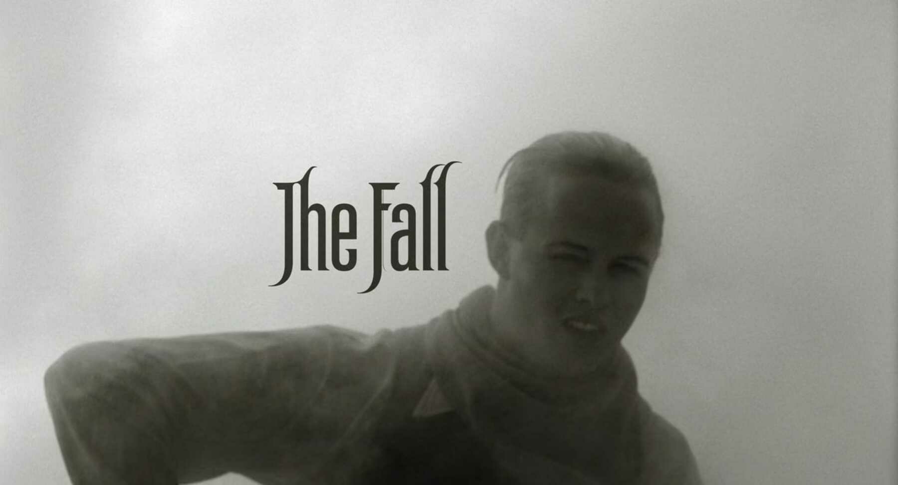 A man enshrouded in thick and heavy steam with the title card of the film, The Fall, shown next to his head.