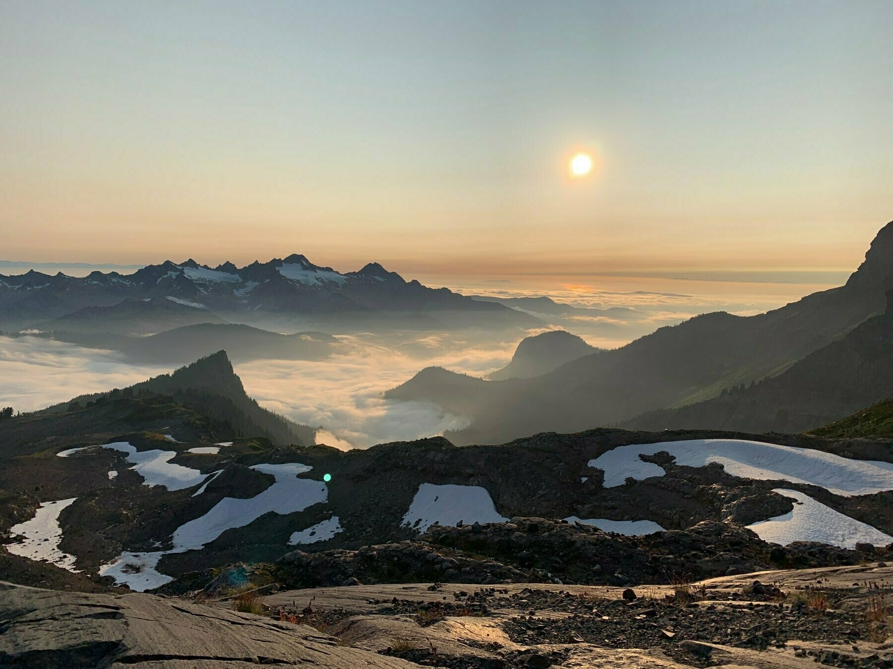 sunset view of mountains and mist at sunset from ½ way up Mt Baker in Washington, US