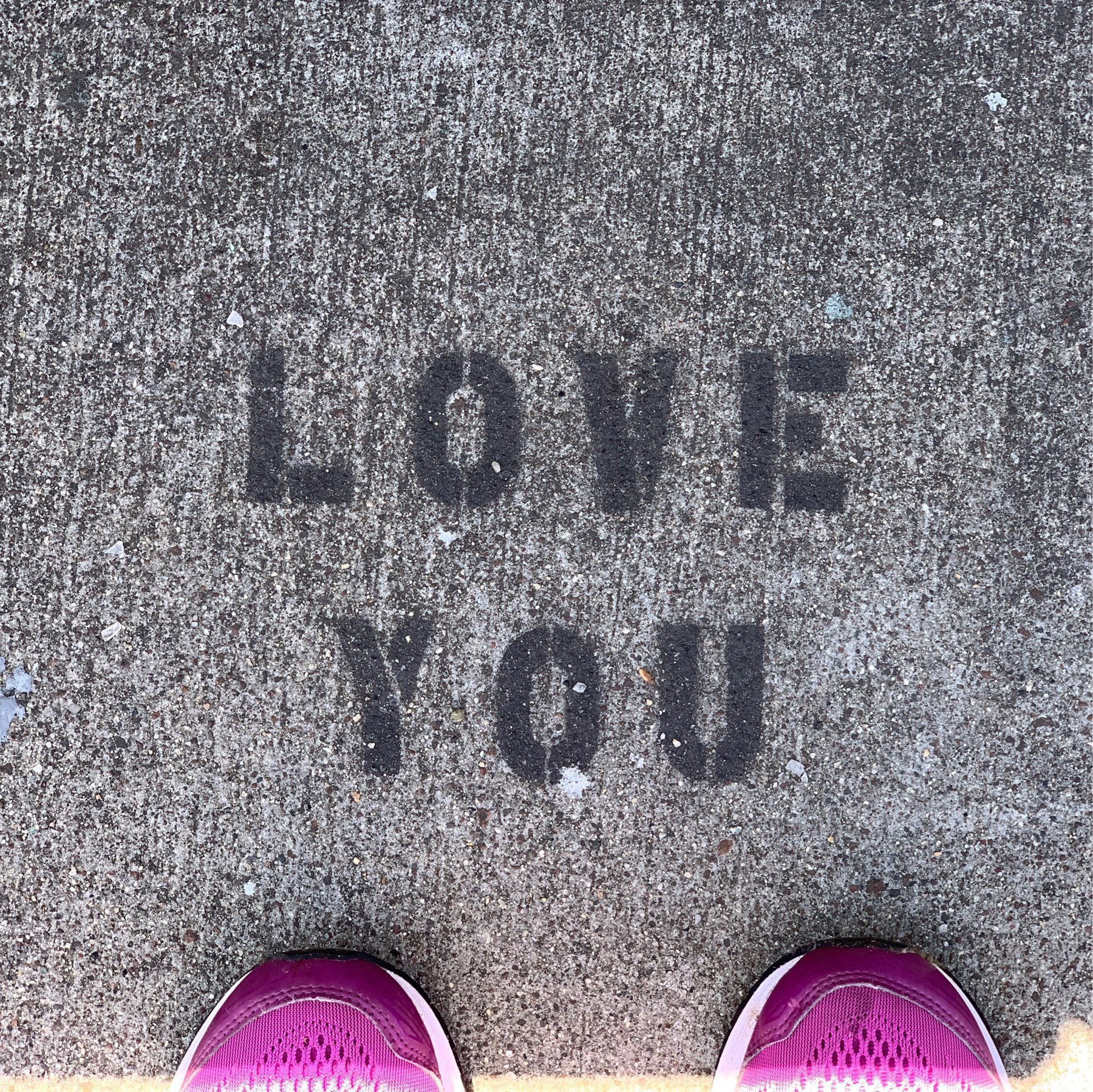 stenciled LOVE YOU on the sidewalk