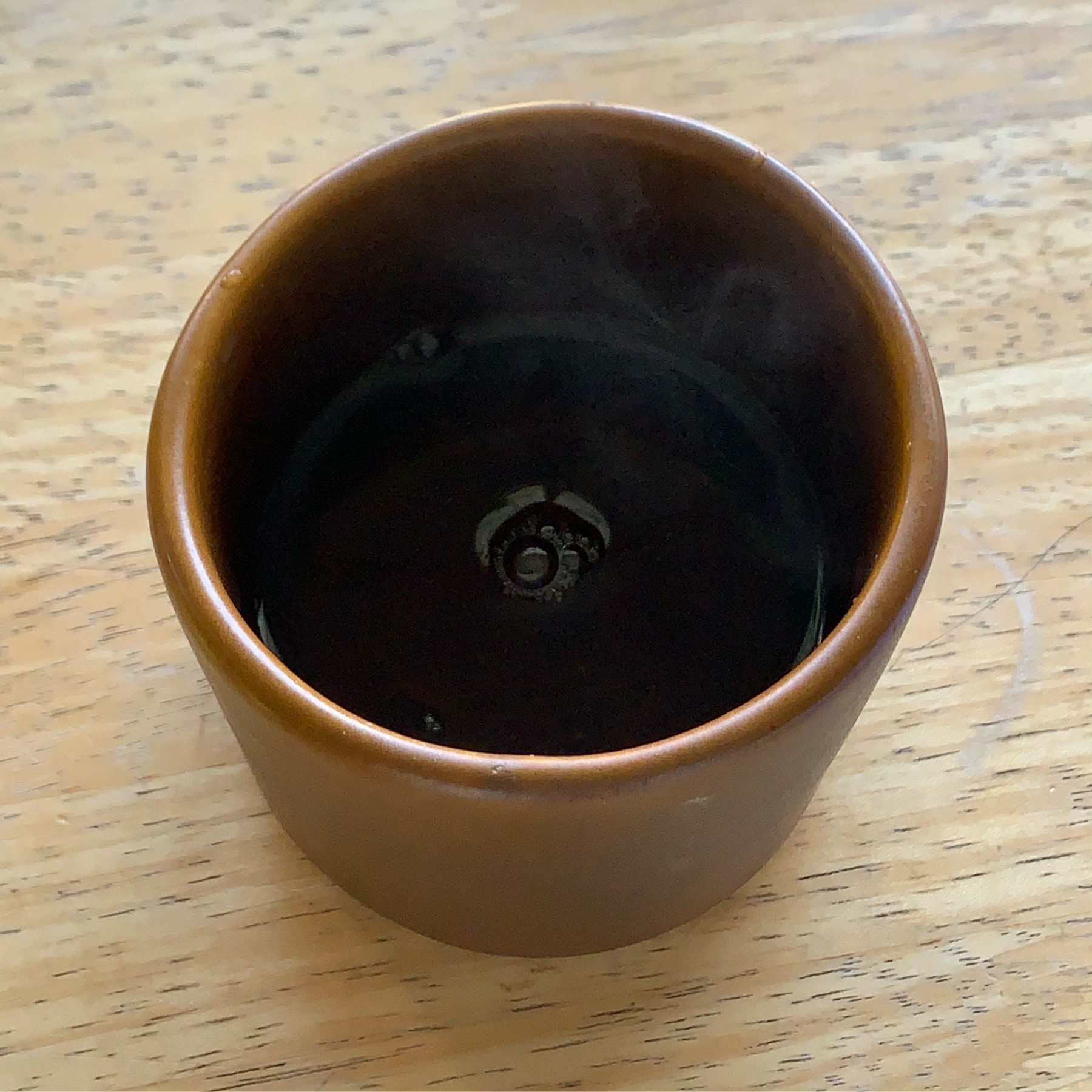 plain tea cup on a wood table