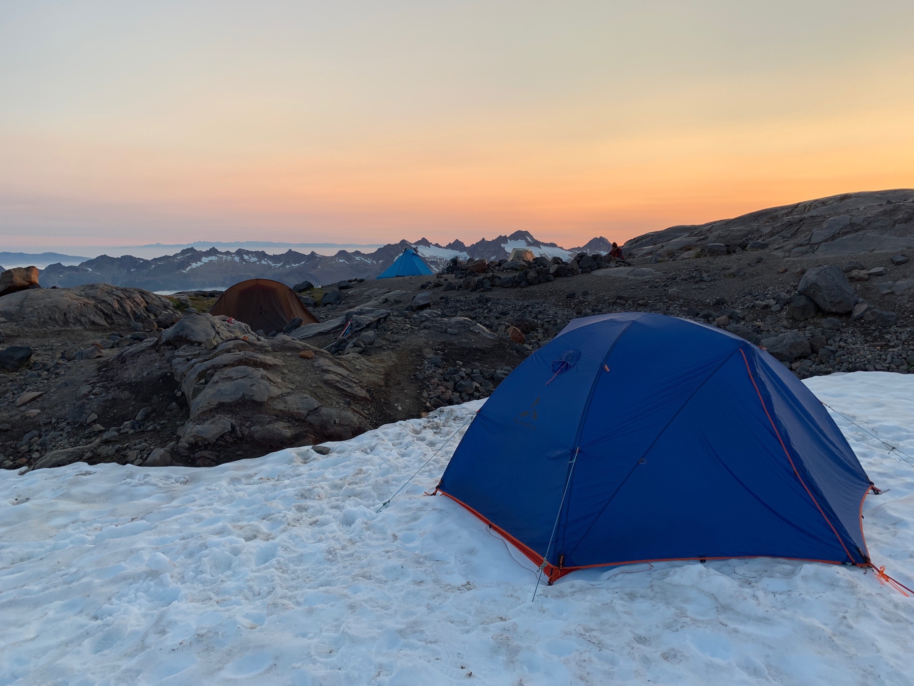 blue tent at sunset on top of Mt Baker, WA, US