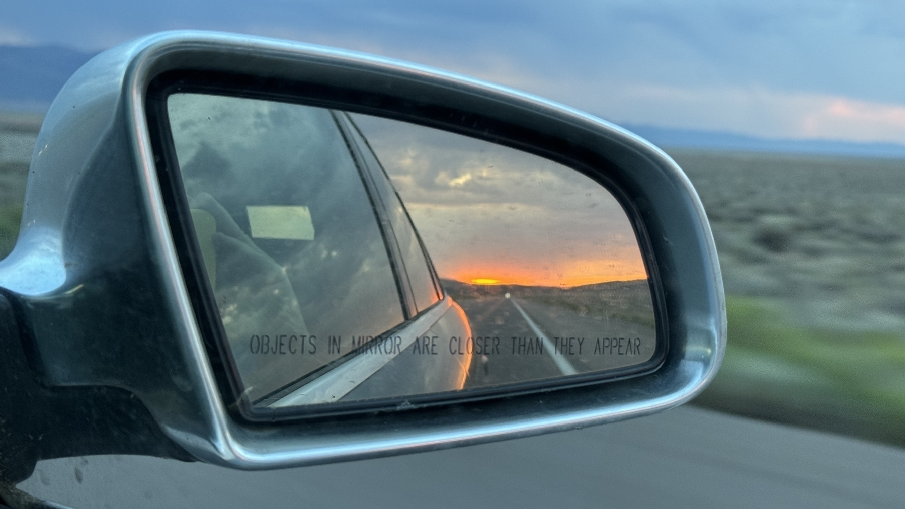 Sunset in a car side mirror