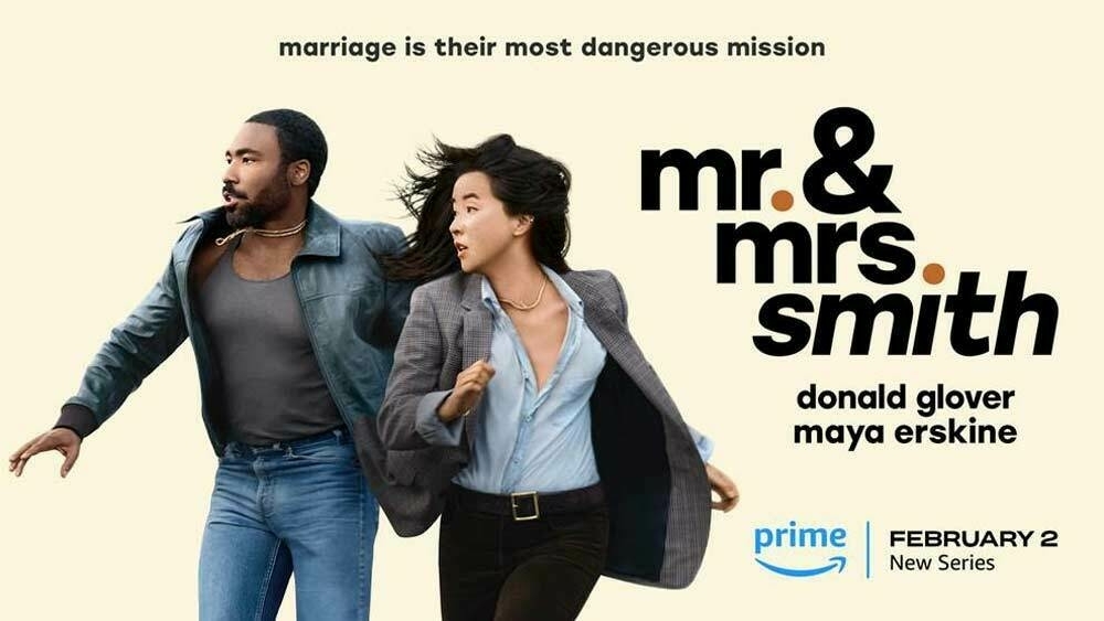 Auto-generated description: Two people are depicted running together with text above and beside them promoting the new series Mr. & Mrs. Smith premiering on Prime on February 2.