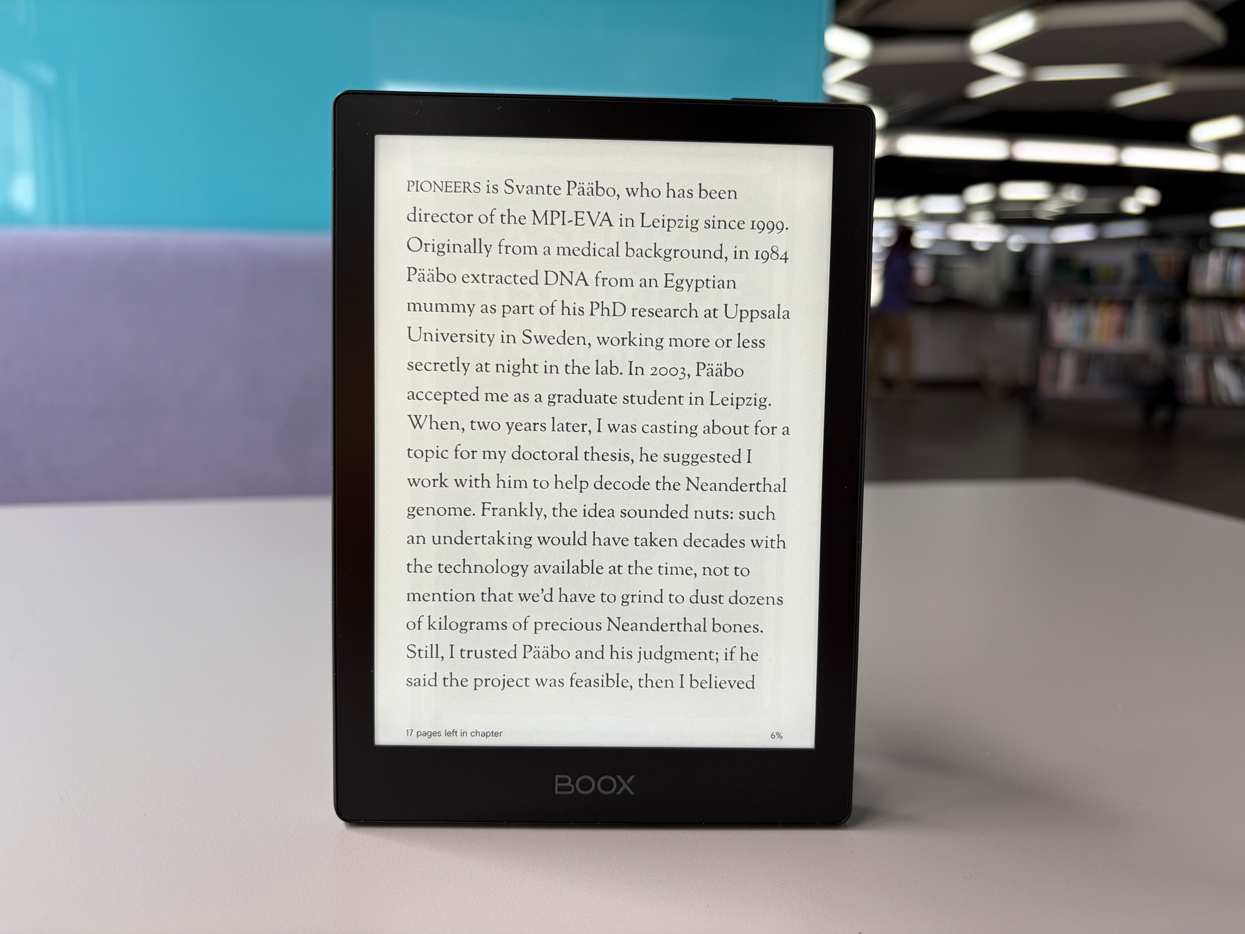 Auto-generated description: An e-reader displays a page of text detailing Svante Pääbo's work on decoding the Neanderthal genome.