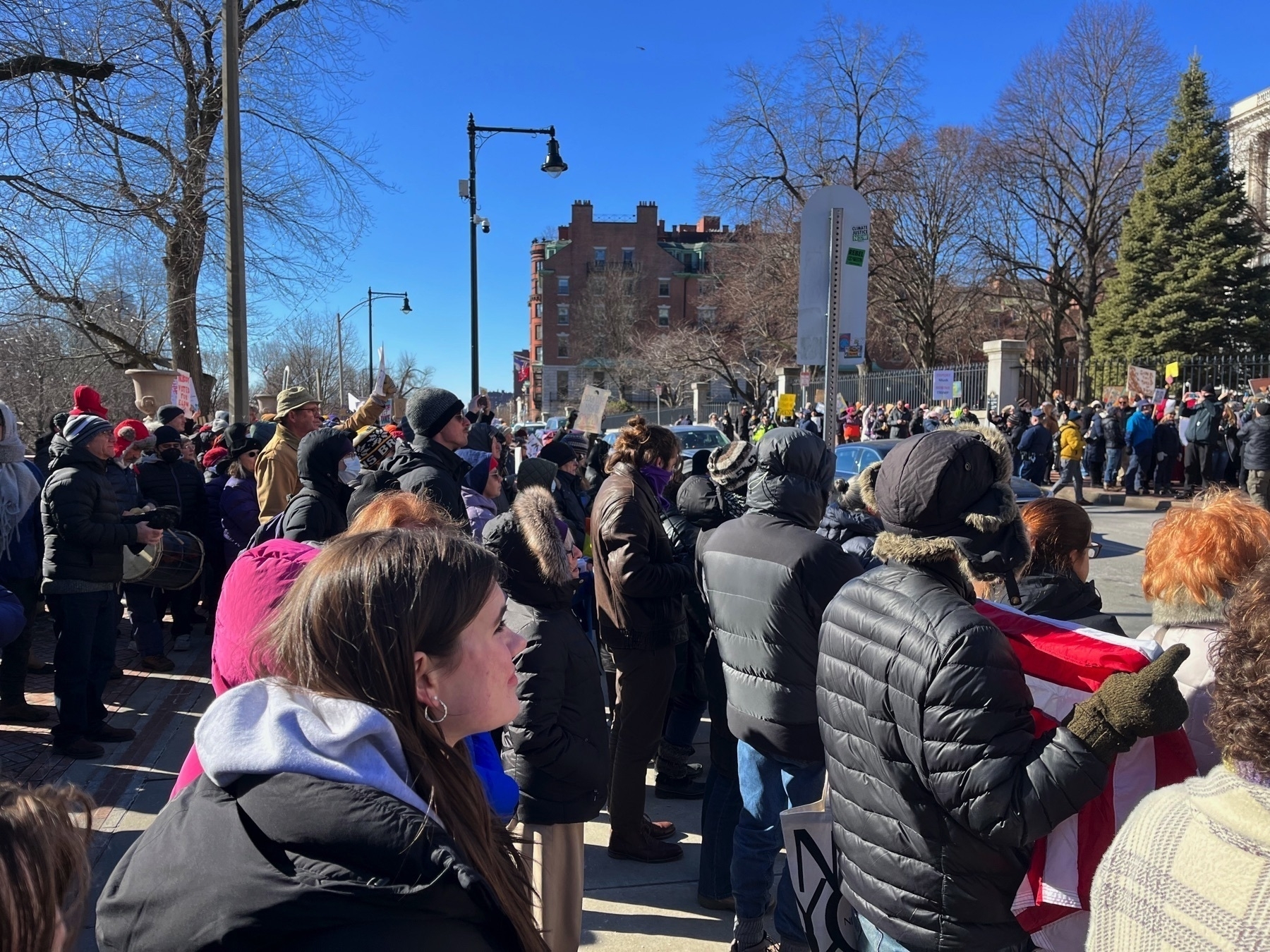 A lot of people standing and protesting.