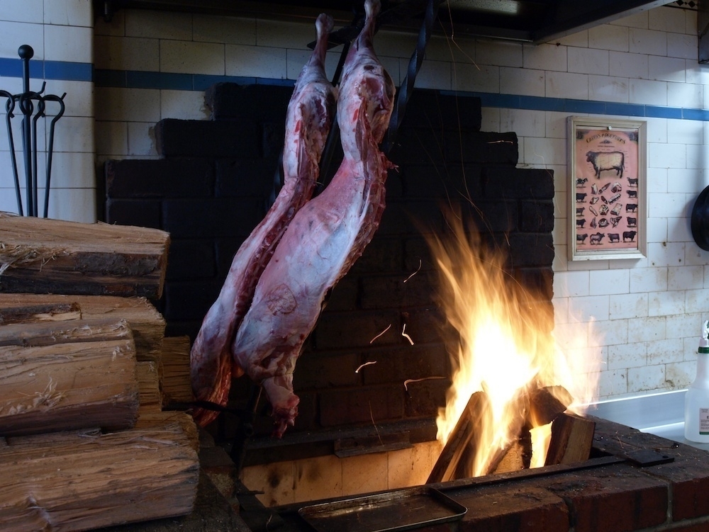 The lamb, cooking over the open fire