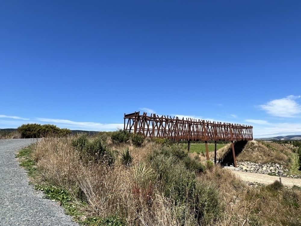 The second bridge from the previouis picture is now highlighted here. It looks like an old style railway bridge but has many decorative pieces of steel on its sides.