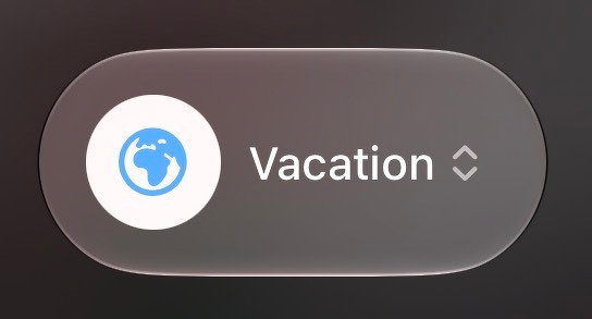 Focus mode setting in the iOS Control Center. It is set to vacation focus mode.