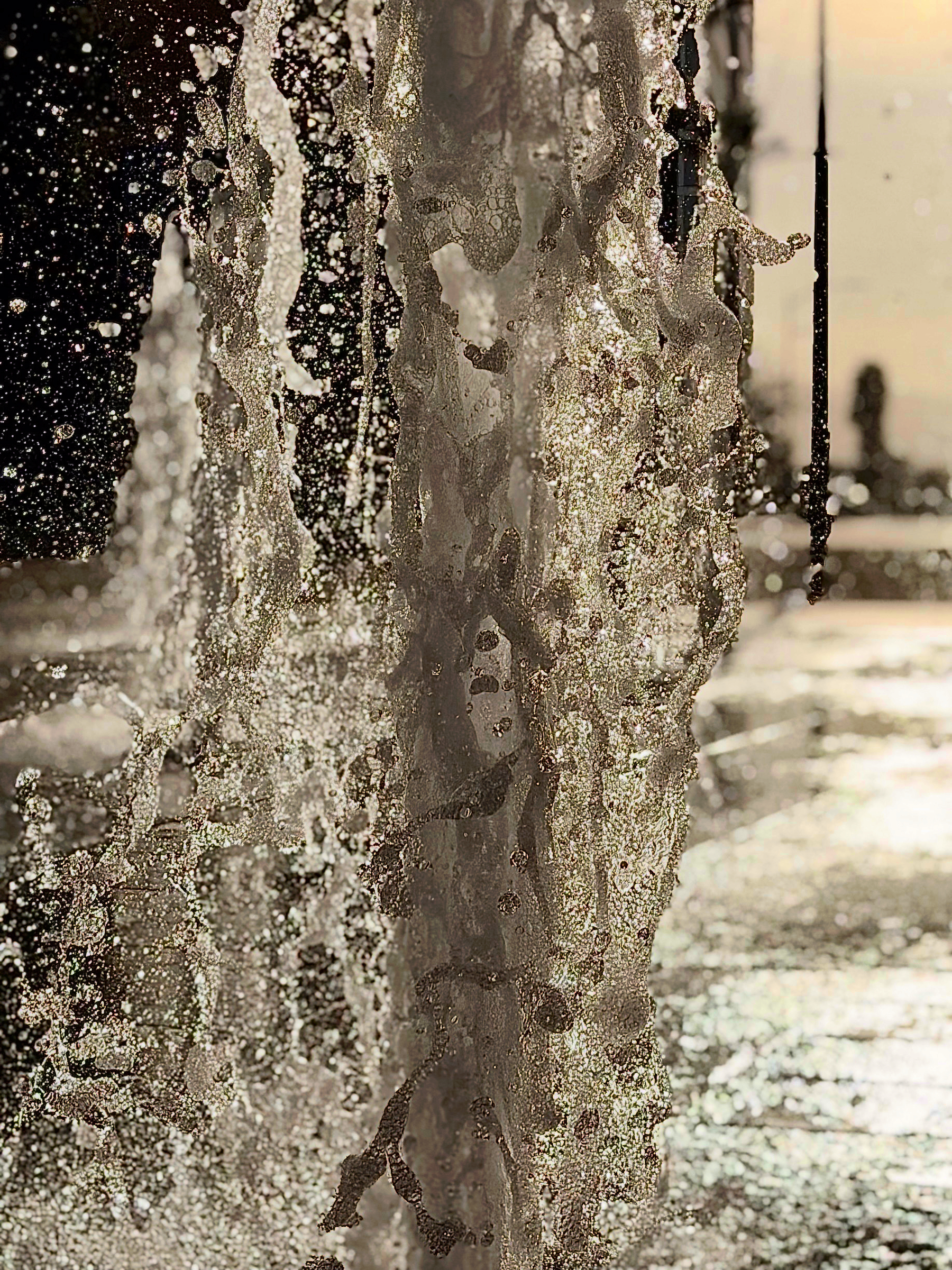 Auto-generated description: A dynamic splash of water is captured mid-motion against a bright, outdoor backdrop.