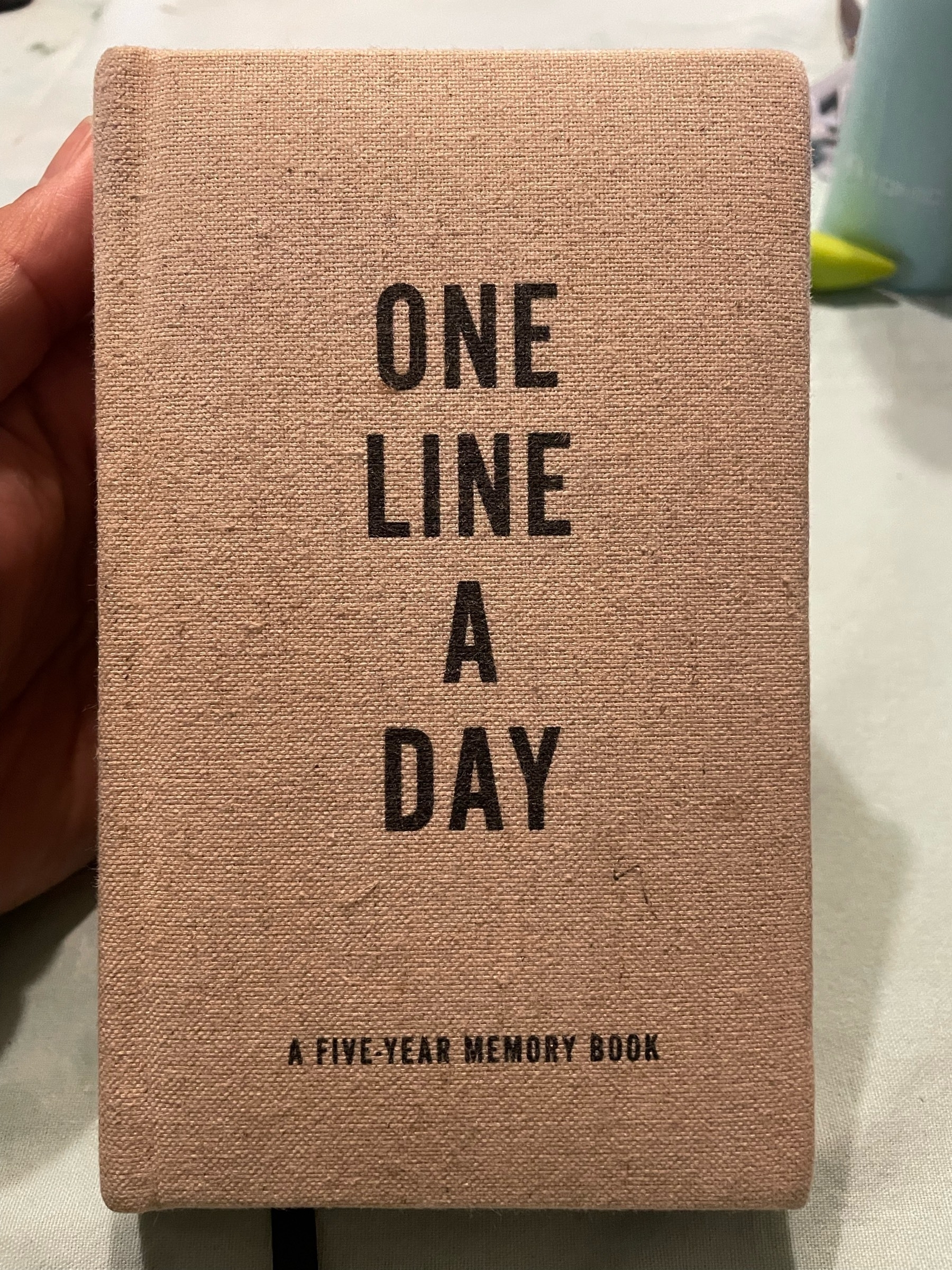 Small notebook with the words One Line a Day - A five year memory book on the front