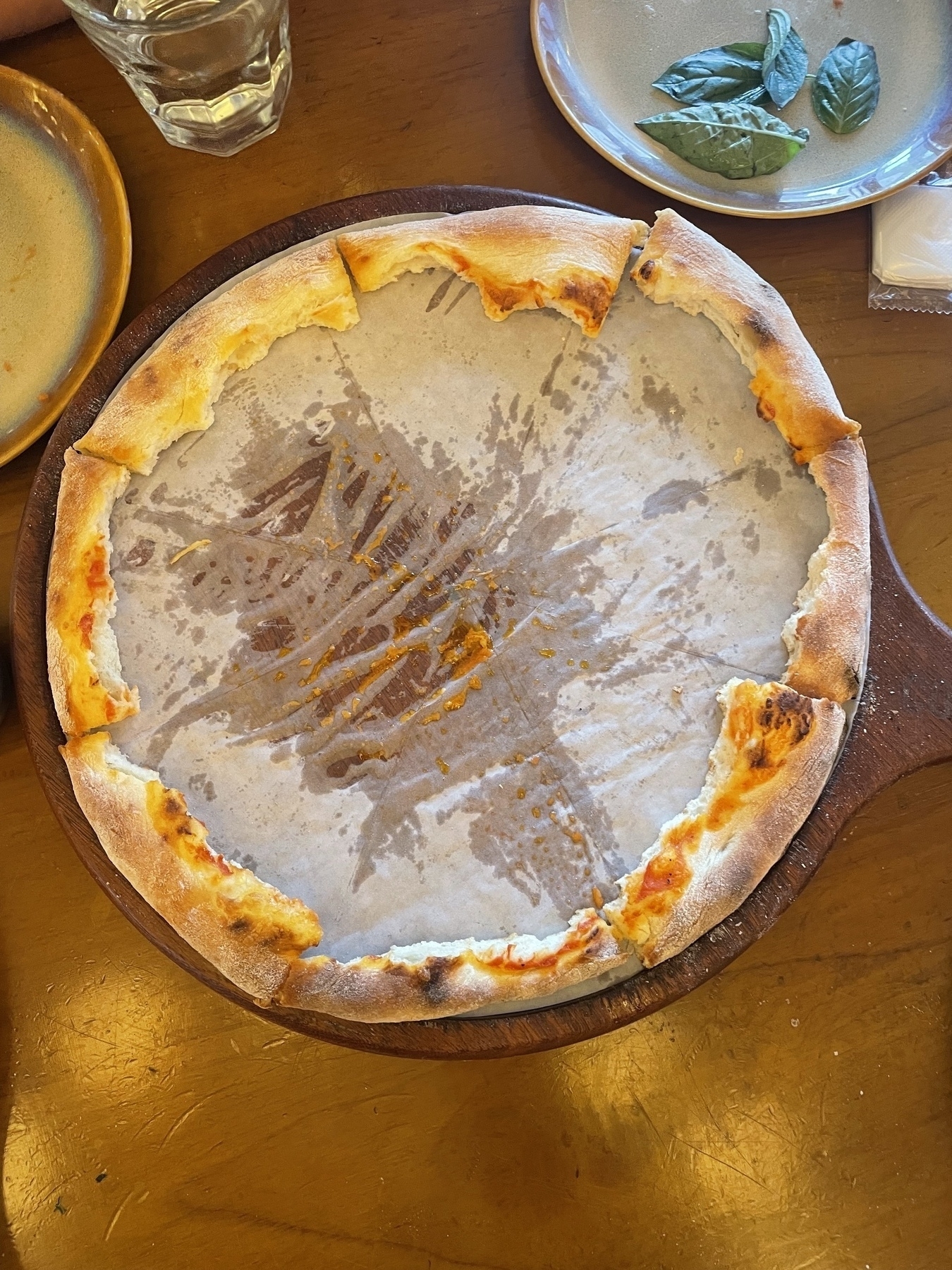 A pizza with the middle eaten out, leaving only the crust.
