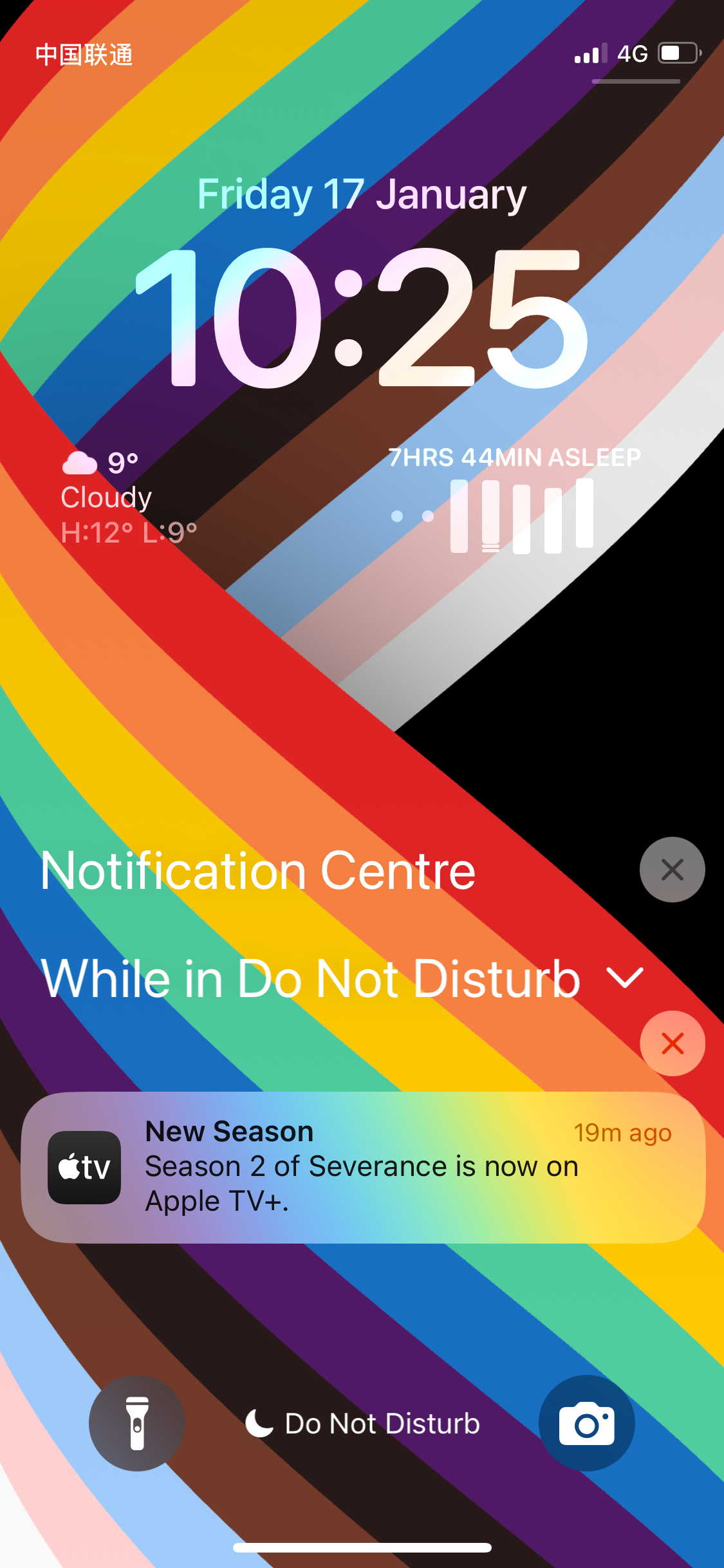 A smartphone screen displays the date, time, weather, and notifications, including a message about "Severance" on Apple TV+, set against a colorful rainbow background.