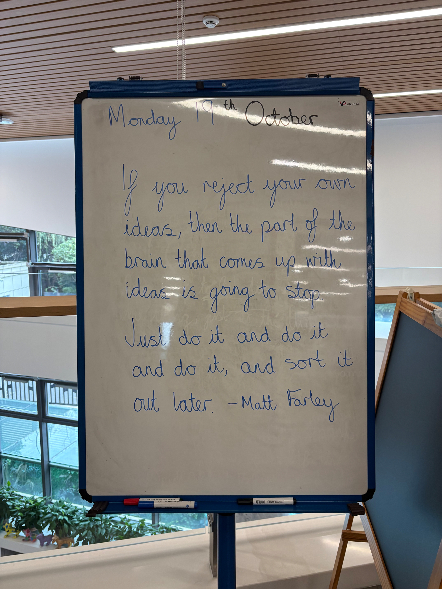 A whiteboard displays a motivational quote dated Monday 19th October, emphasizing the importance of acting on ideas without rejecting them, attributed to Matt Farley.