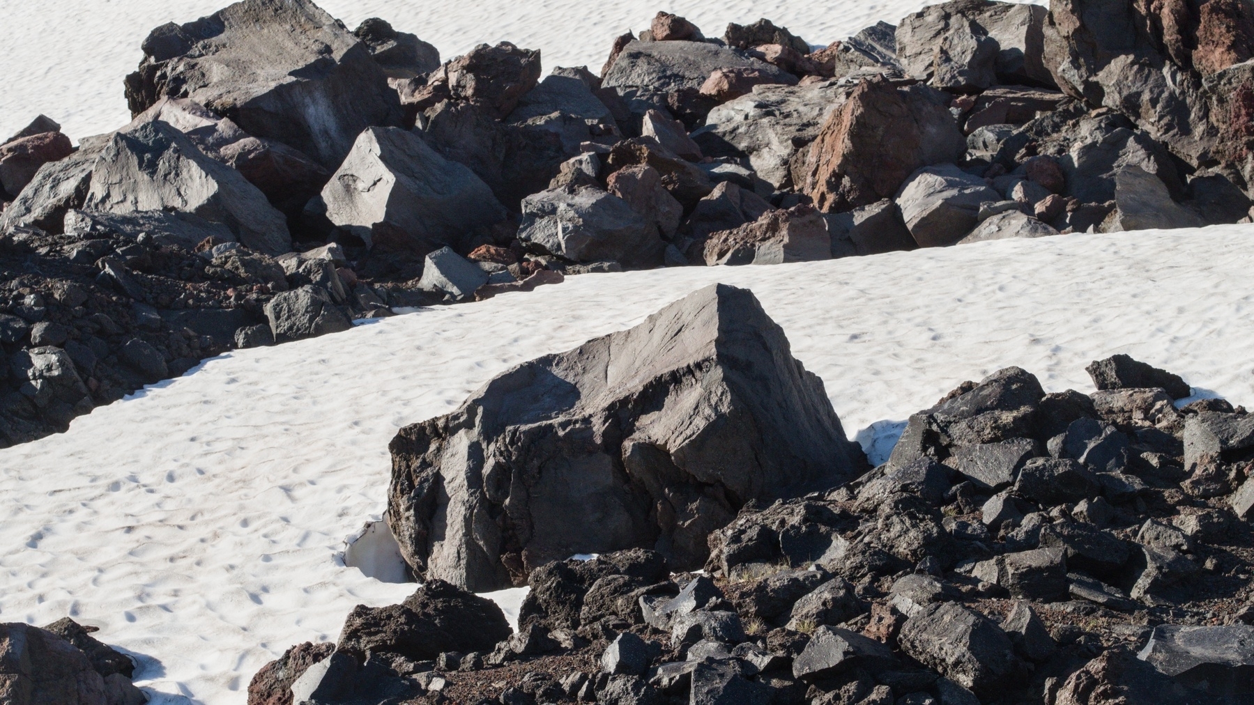 lava rock in a snowfield