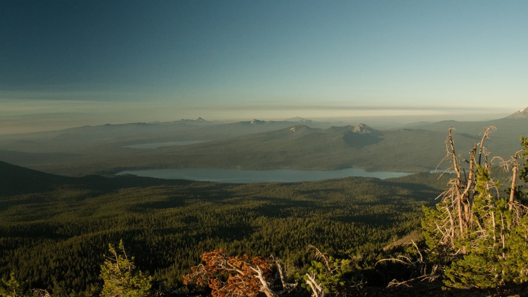 two lakes in distant forest&10;