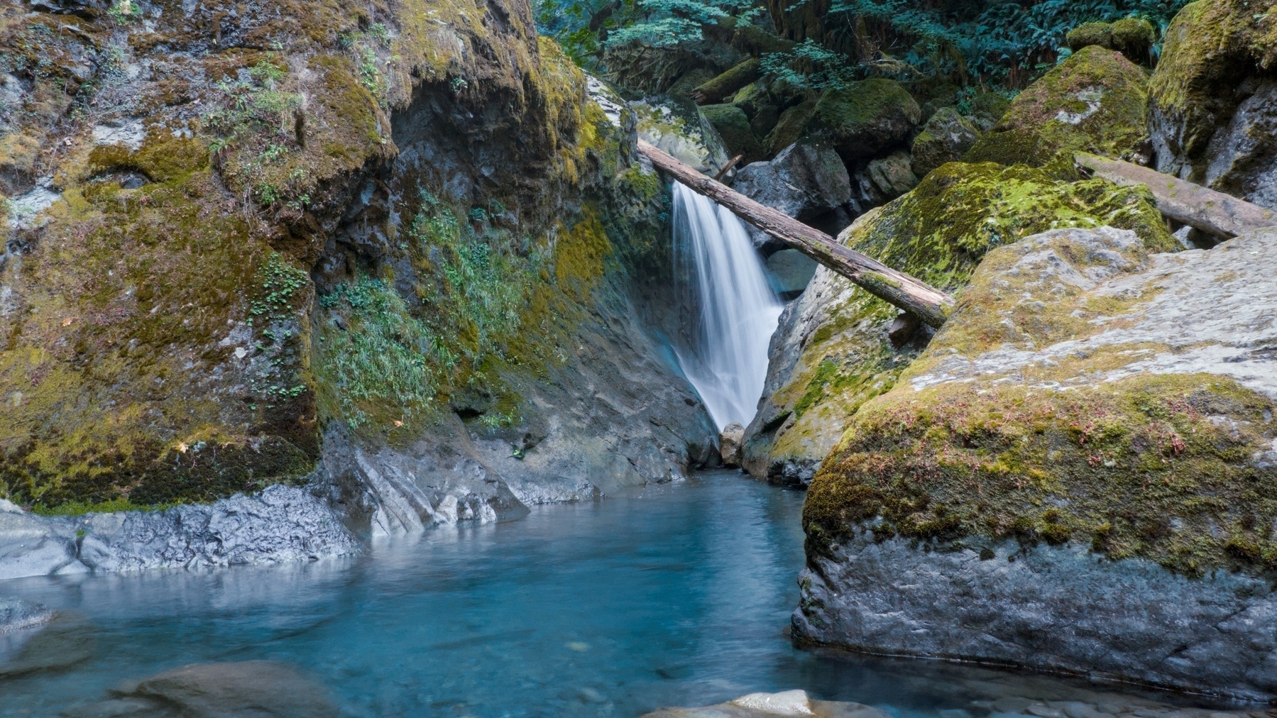 small waterfall in a river canyon
