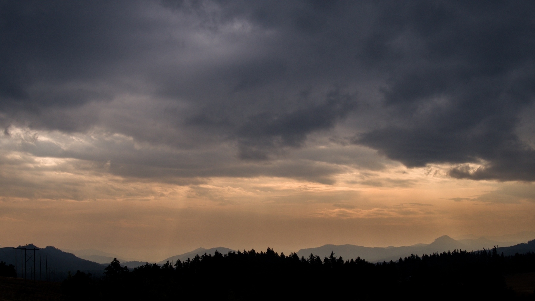 Clouds and smoke over the hills