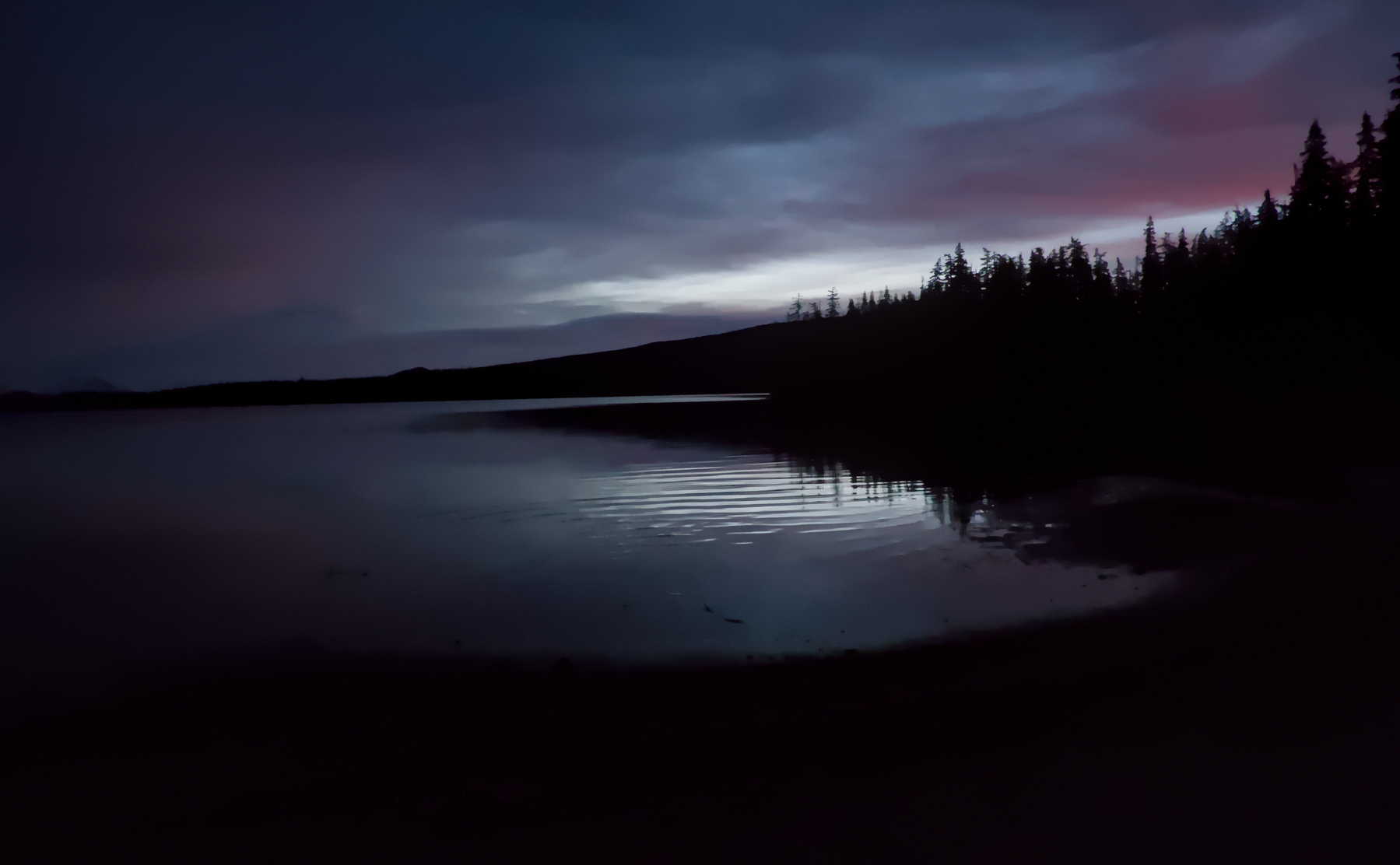 early morning lake with trees and clouds