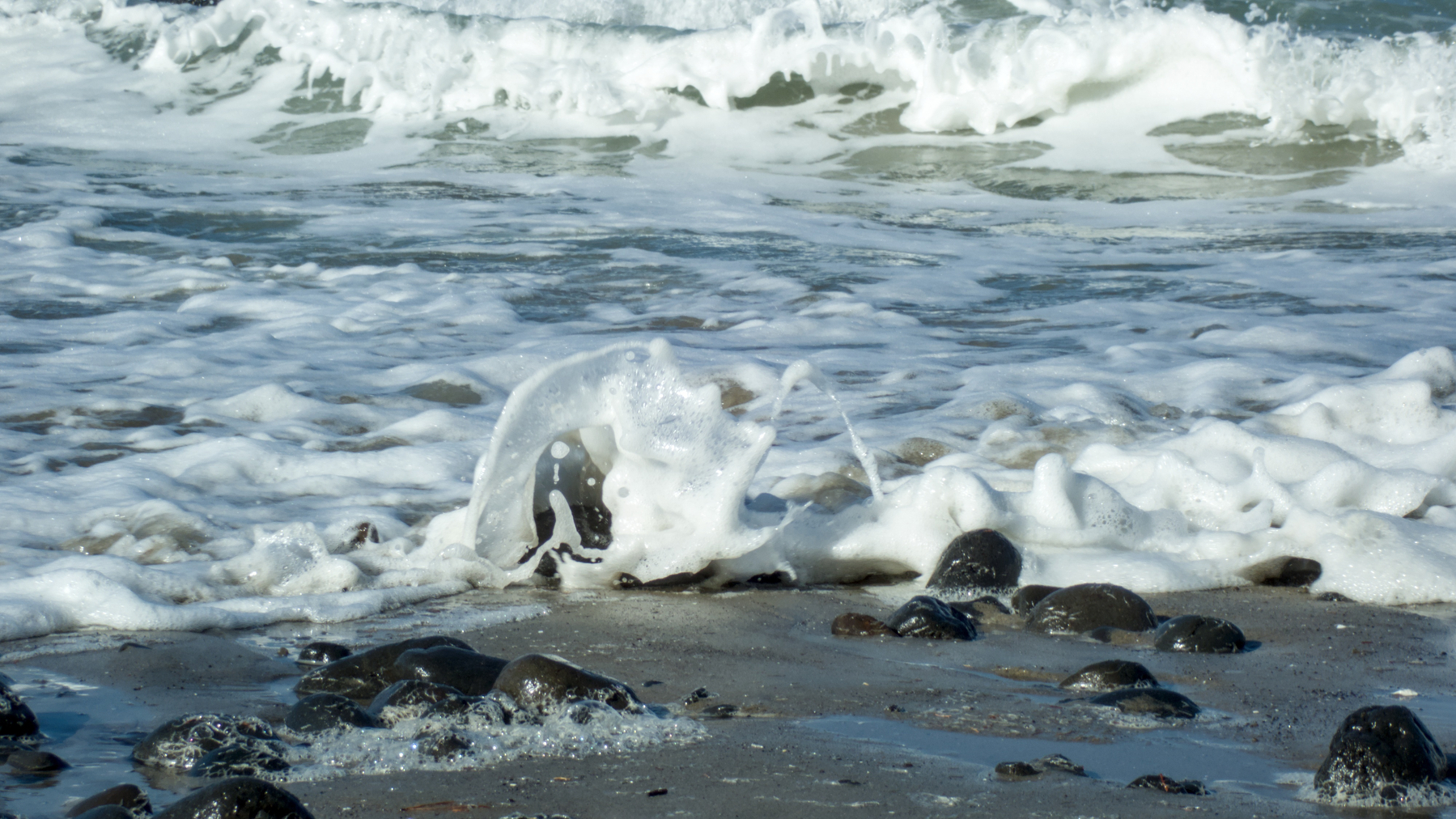 waves breaking on rocks
