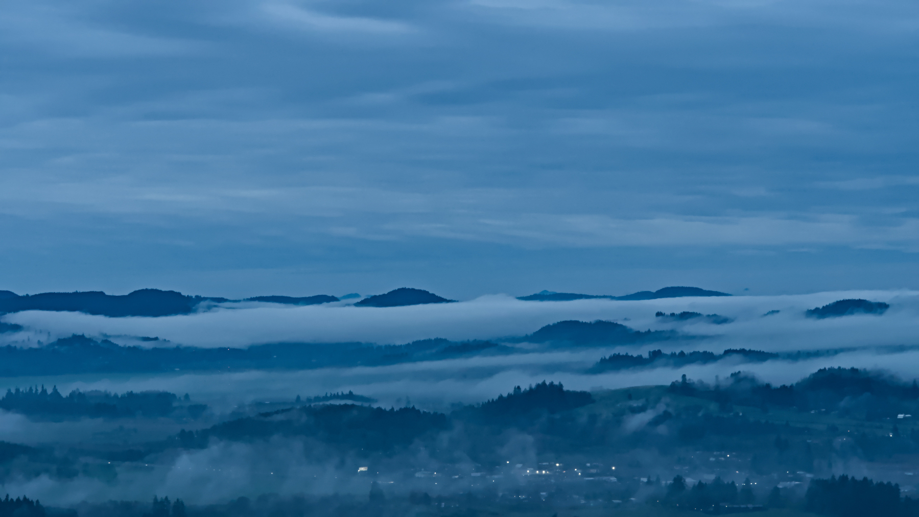 fog burning off at dawn over eugene