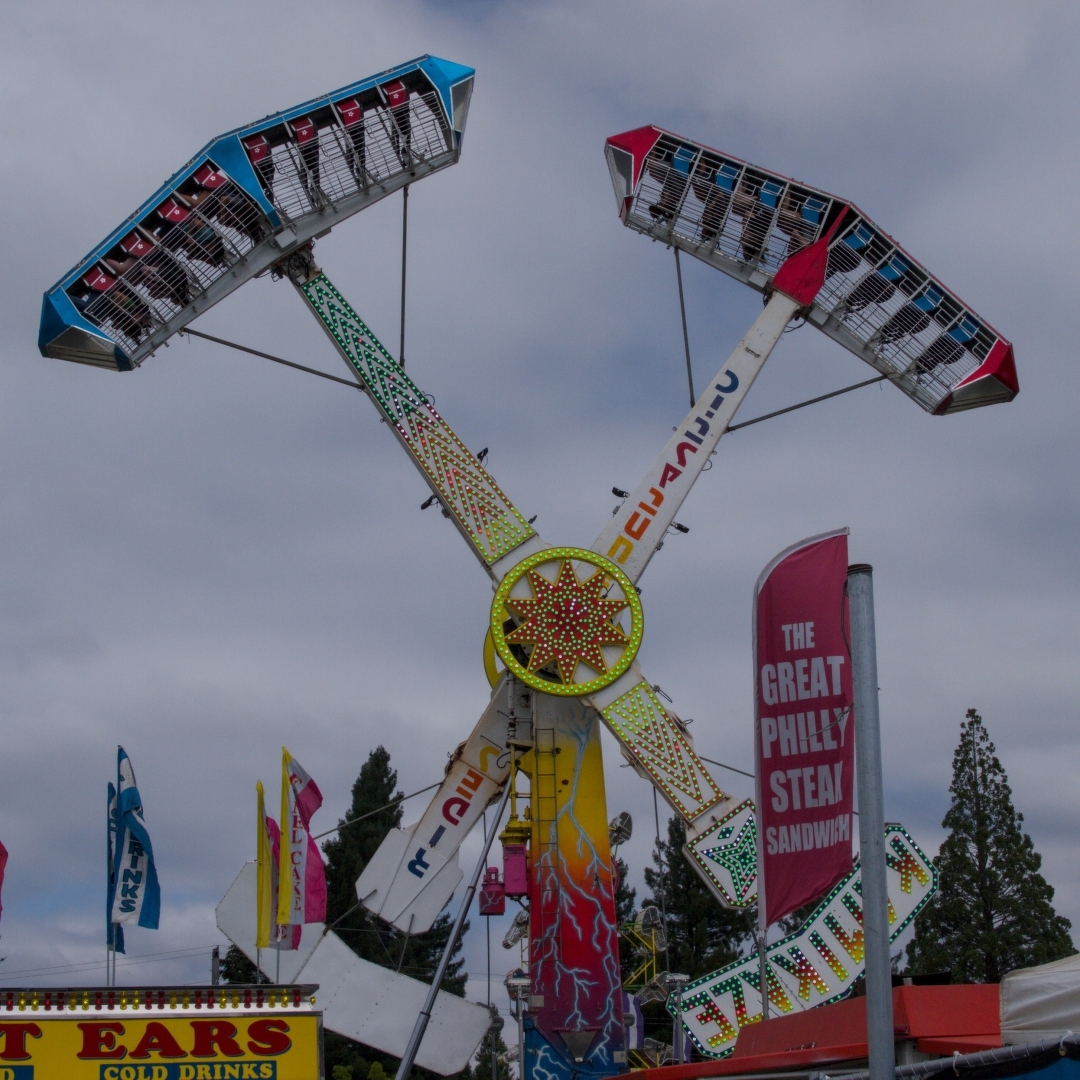 An empty carnival ride, running and all lit up
