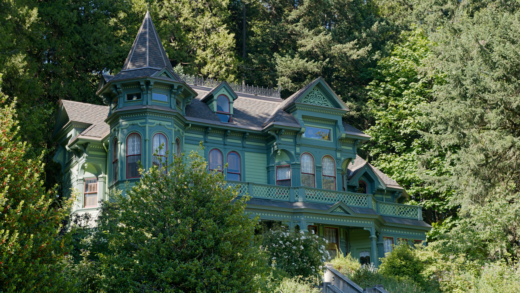 large green house in fancy victorian style