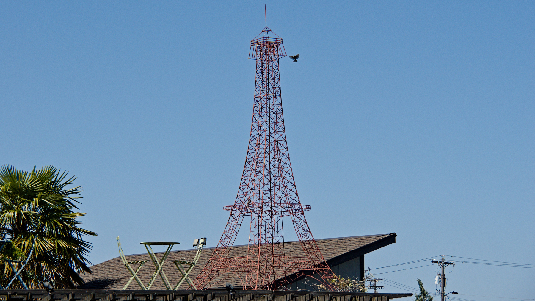 small eiffel tower replica sitting on a roof