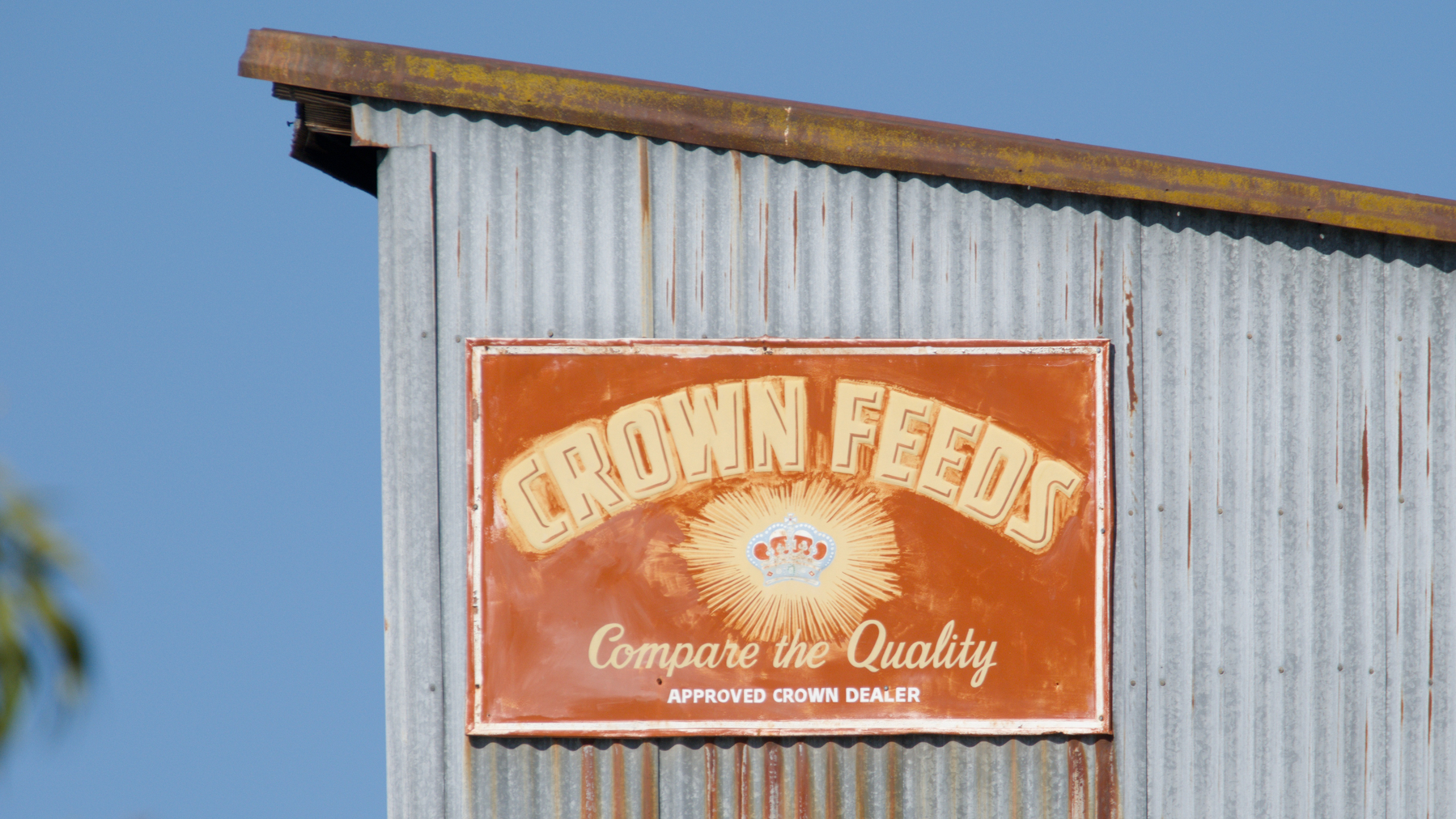 sign on the side of a corrugated metal building