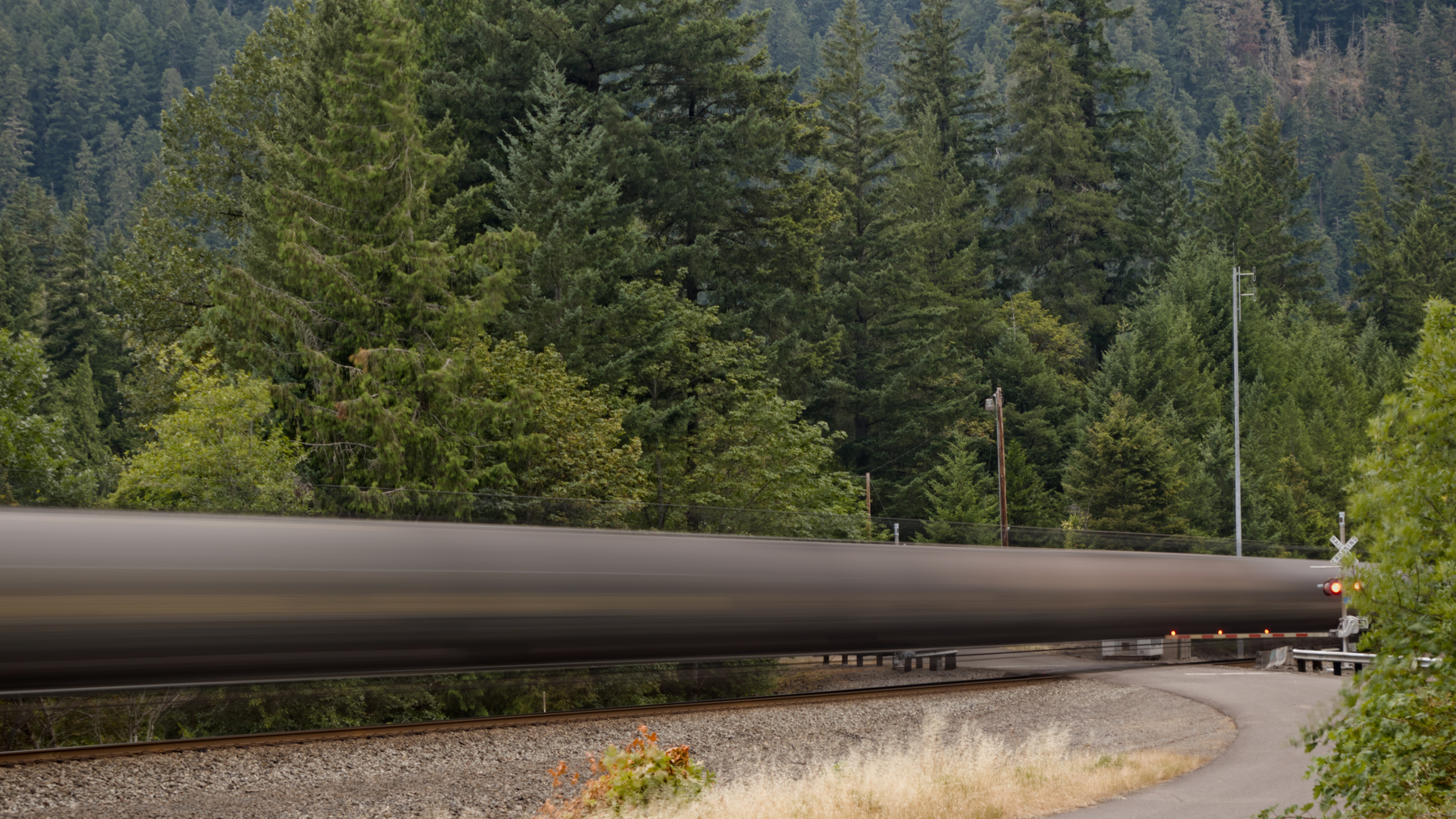 time exposure of tanker cars at a railroad crossing