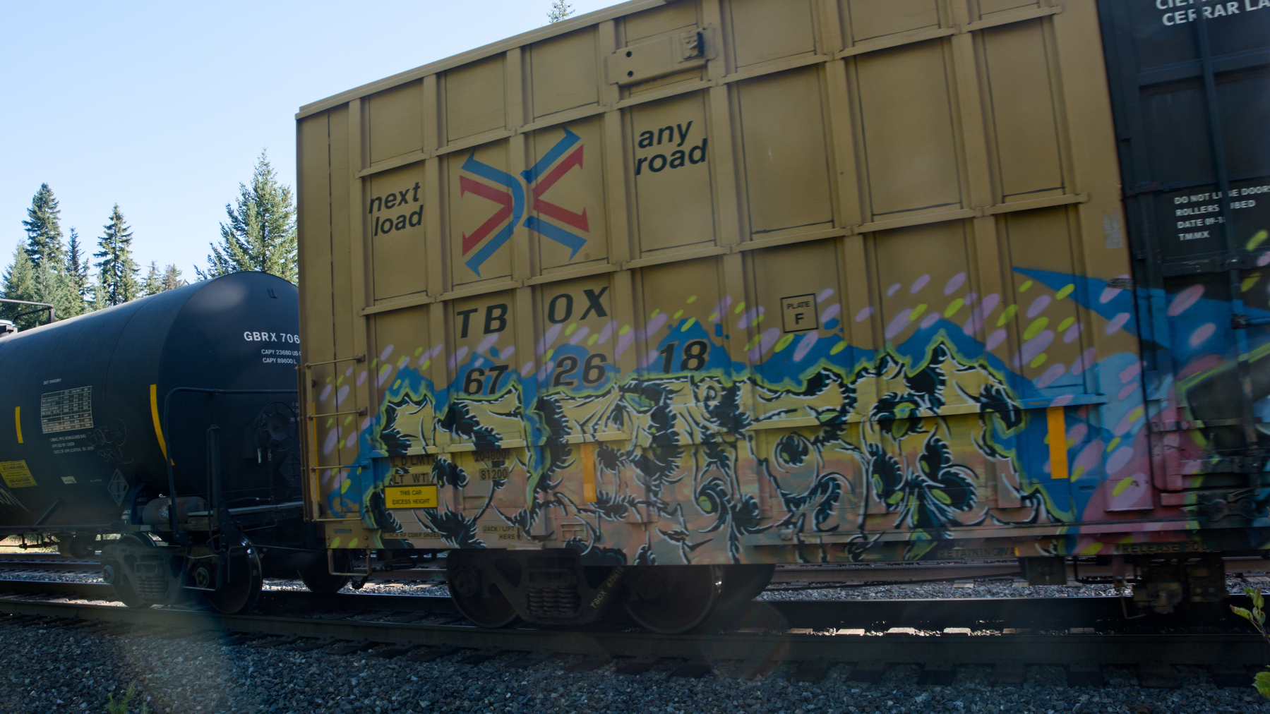 railroad boxcar with fancy graffiti