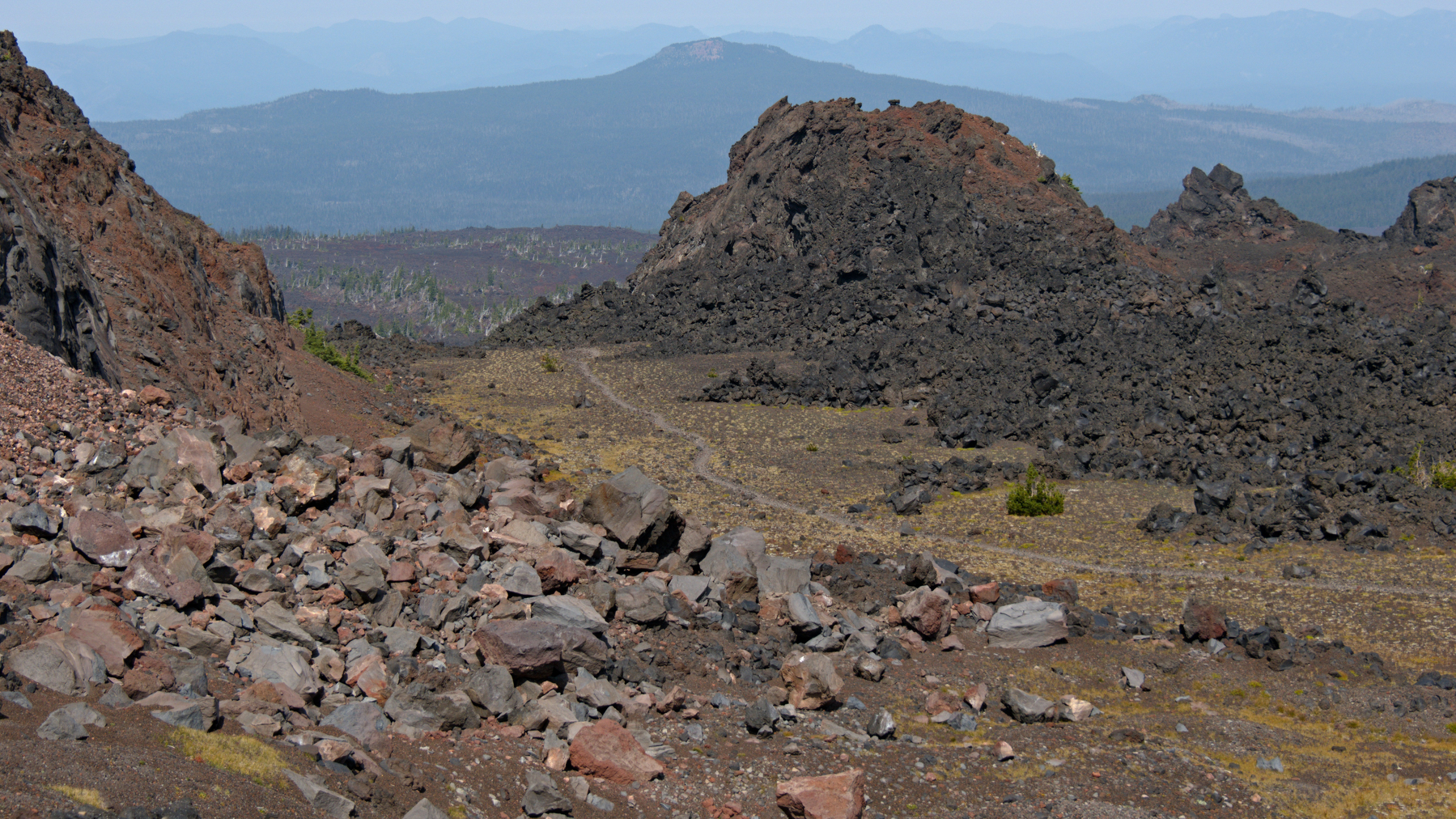 trail through a rocky lava landscape