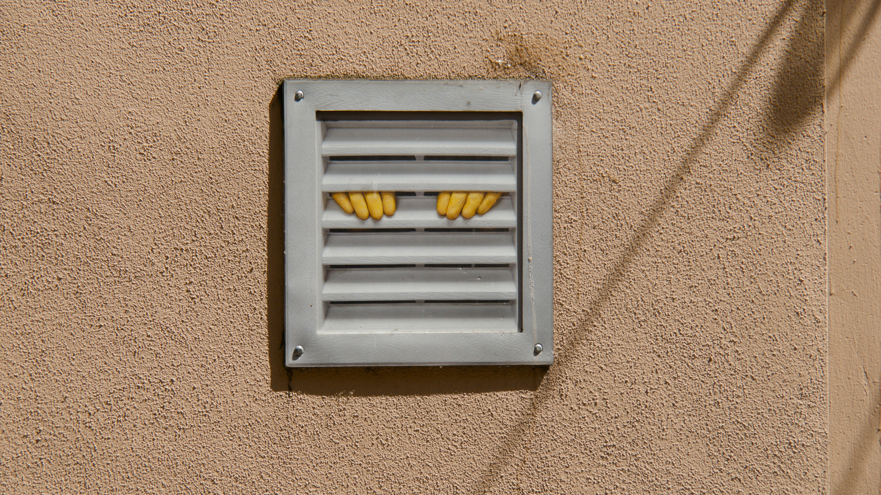 a vent with kilroy-style fingers sticking out