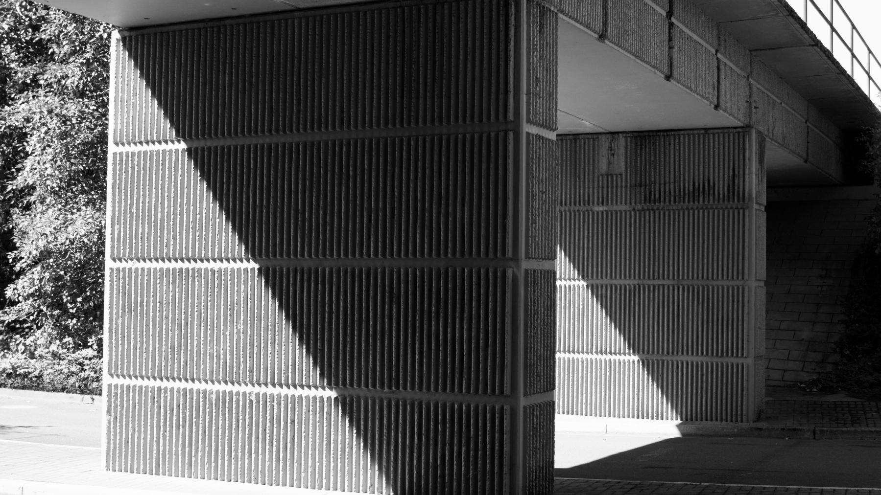 monochrome detail of a concrete bridge in the sun