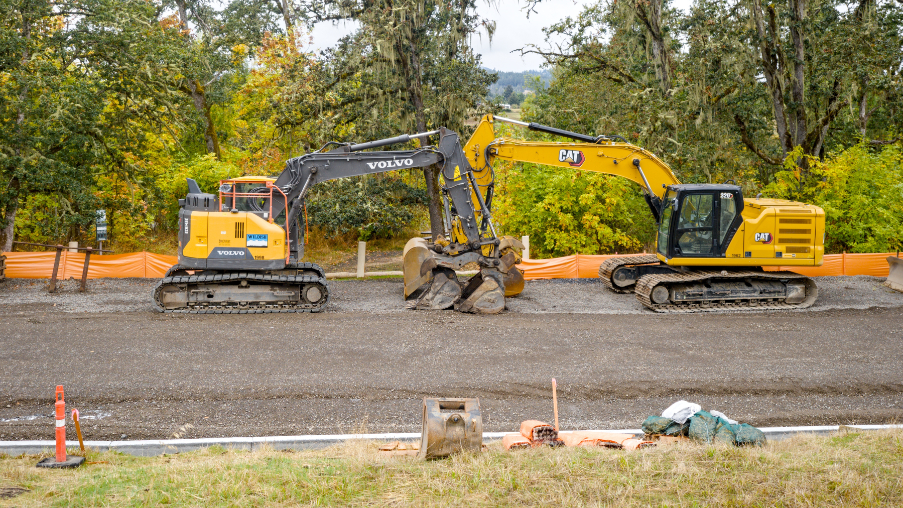 two excavators parked facing each other