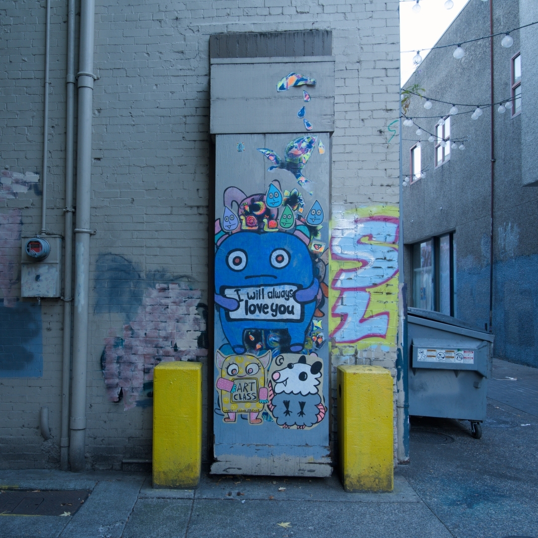 Paint and stickers in an alley in Eugene