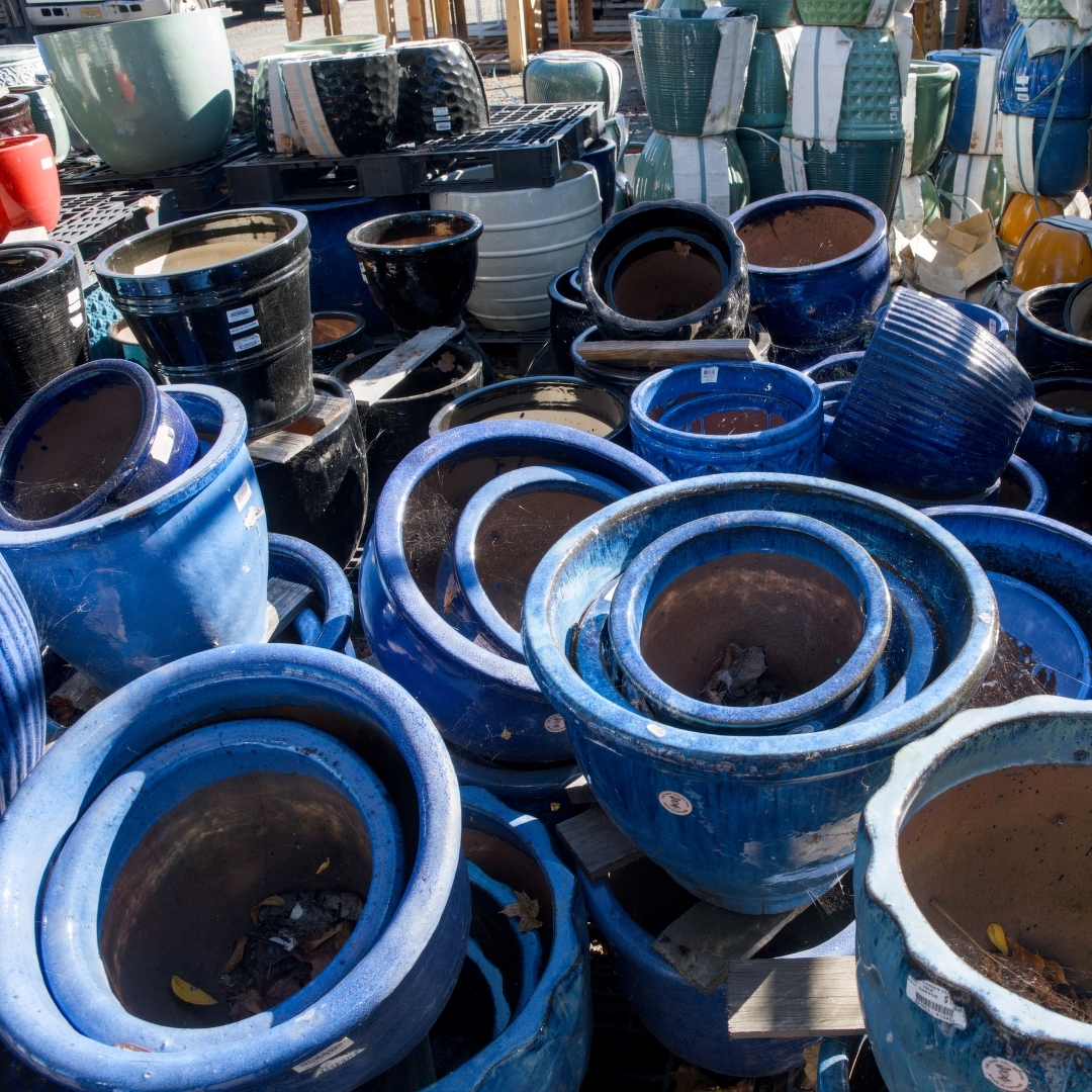 A medley of mostly-blue pots that have seen better days