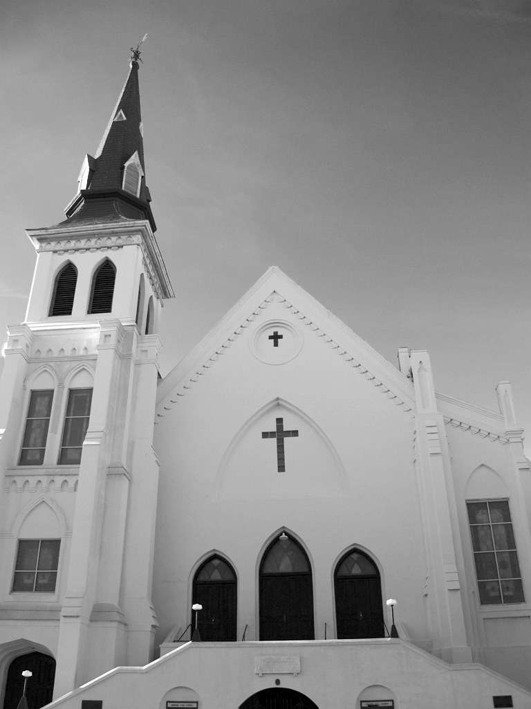 Black and white image of a historic white church building