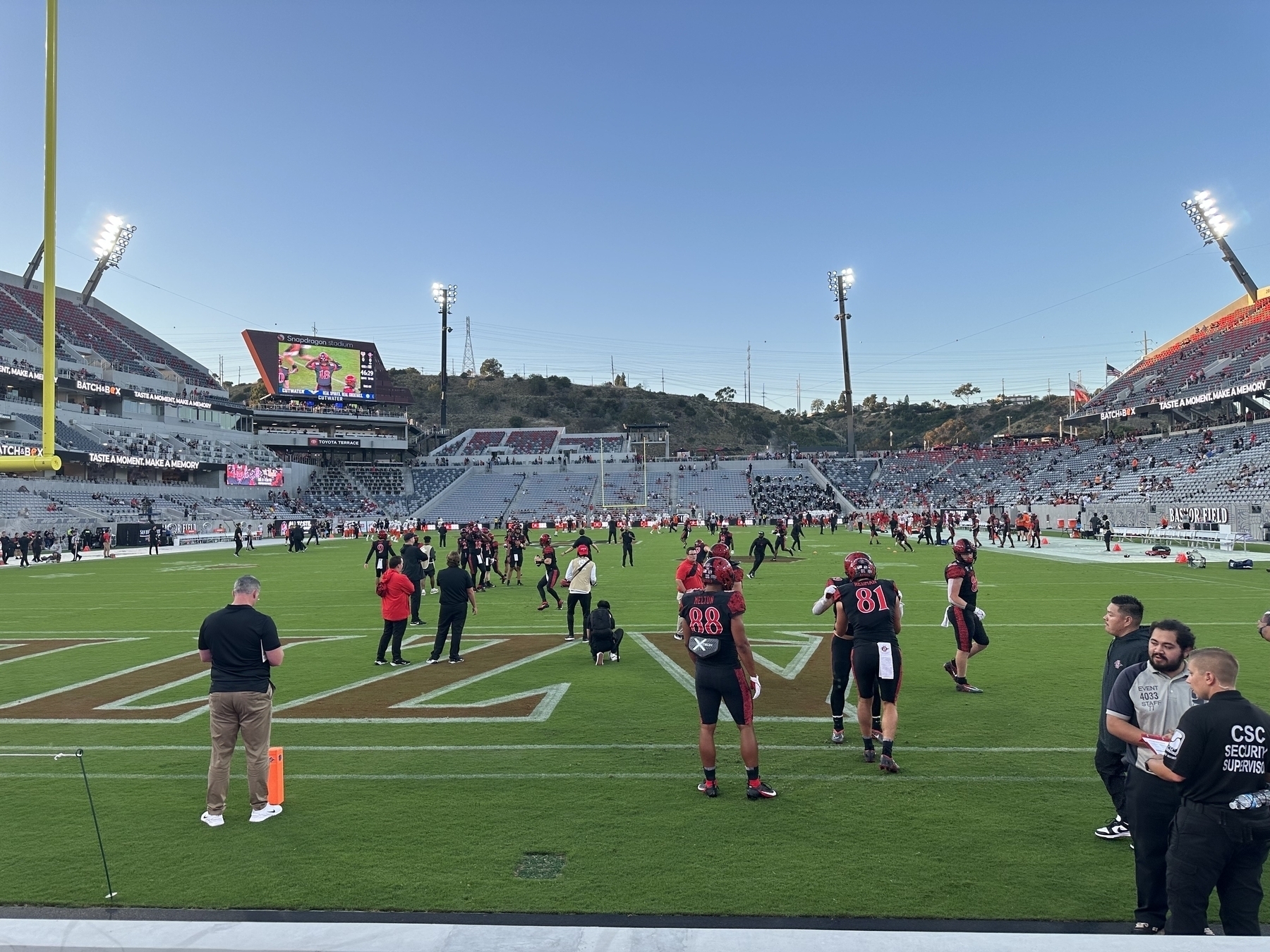 Players warming up on the field at Snapdragon Stadium in San Diego, California, USA.
