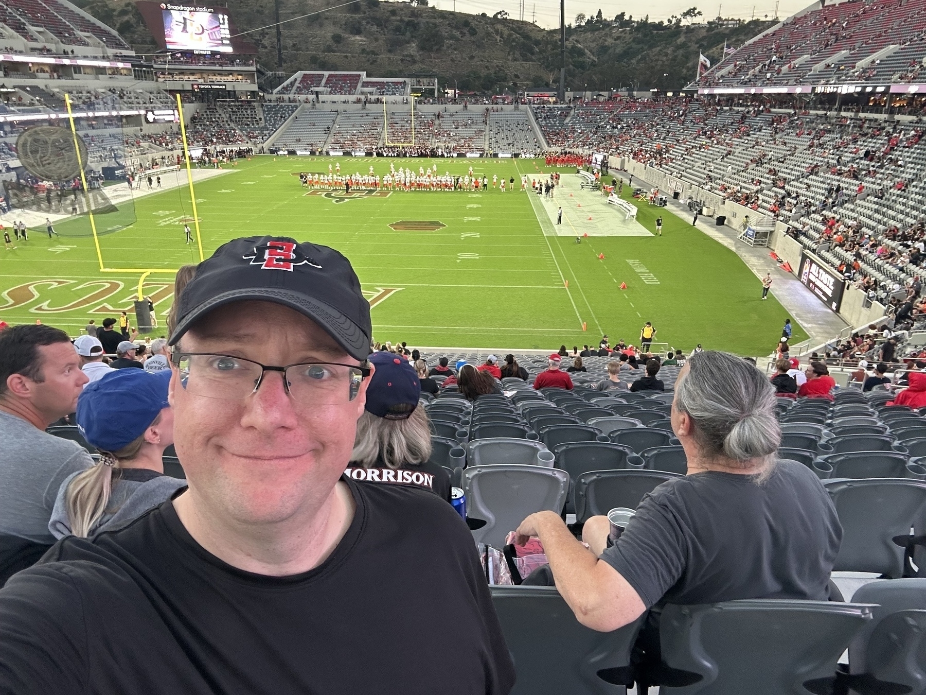 Self of the author in front a pregame football field at Snapdragon Stadium in San Diego, California, USA.