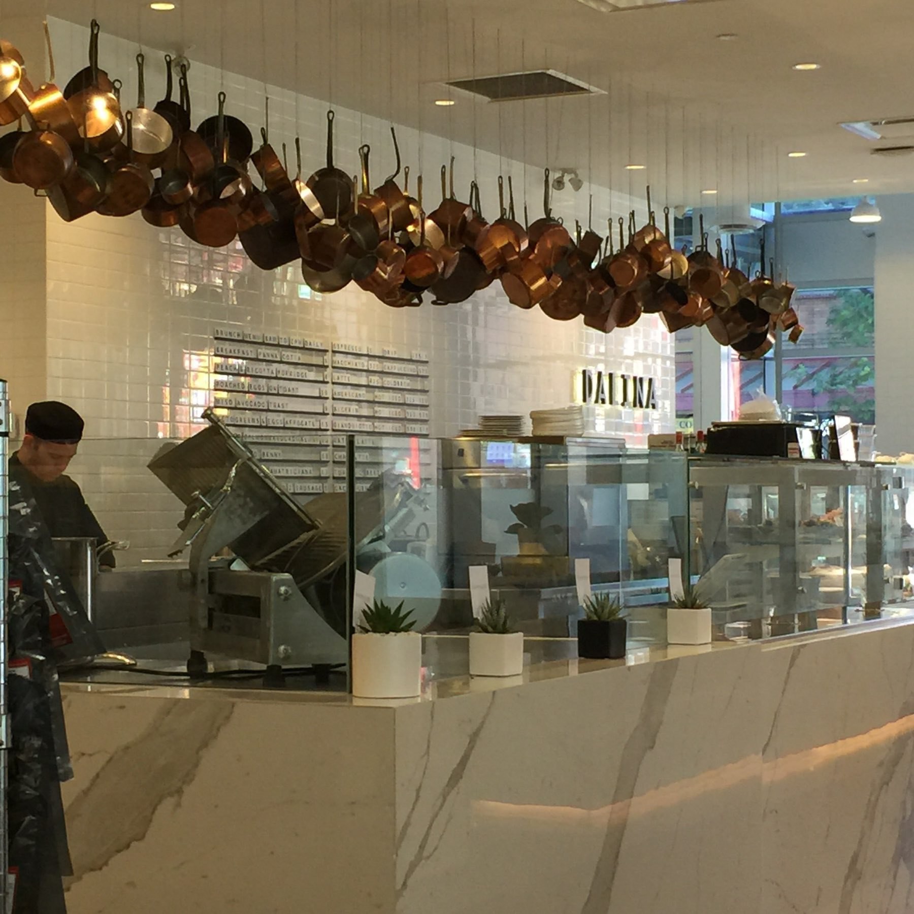 copper pots hanging at Dalina Coffee, Vancouver