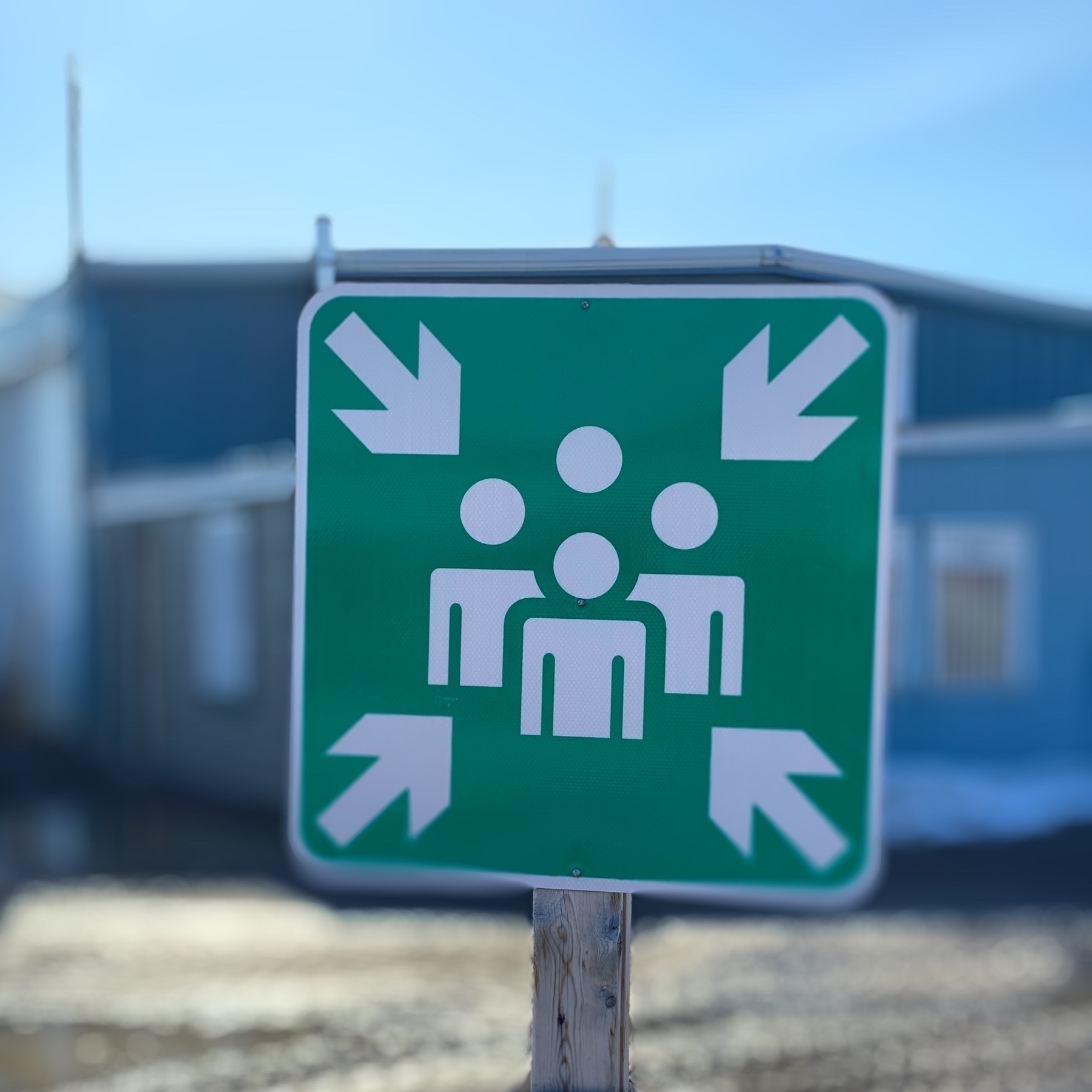 photo of sign showing 4 people pushing together