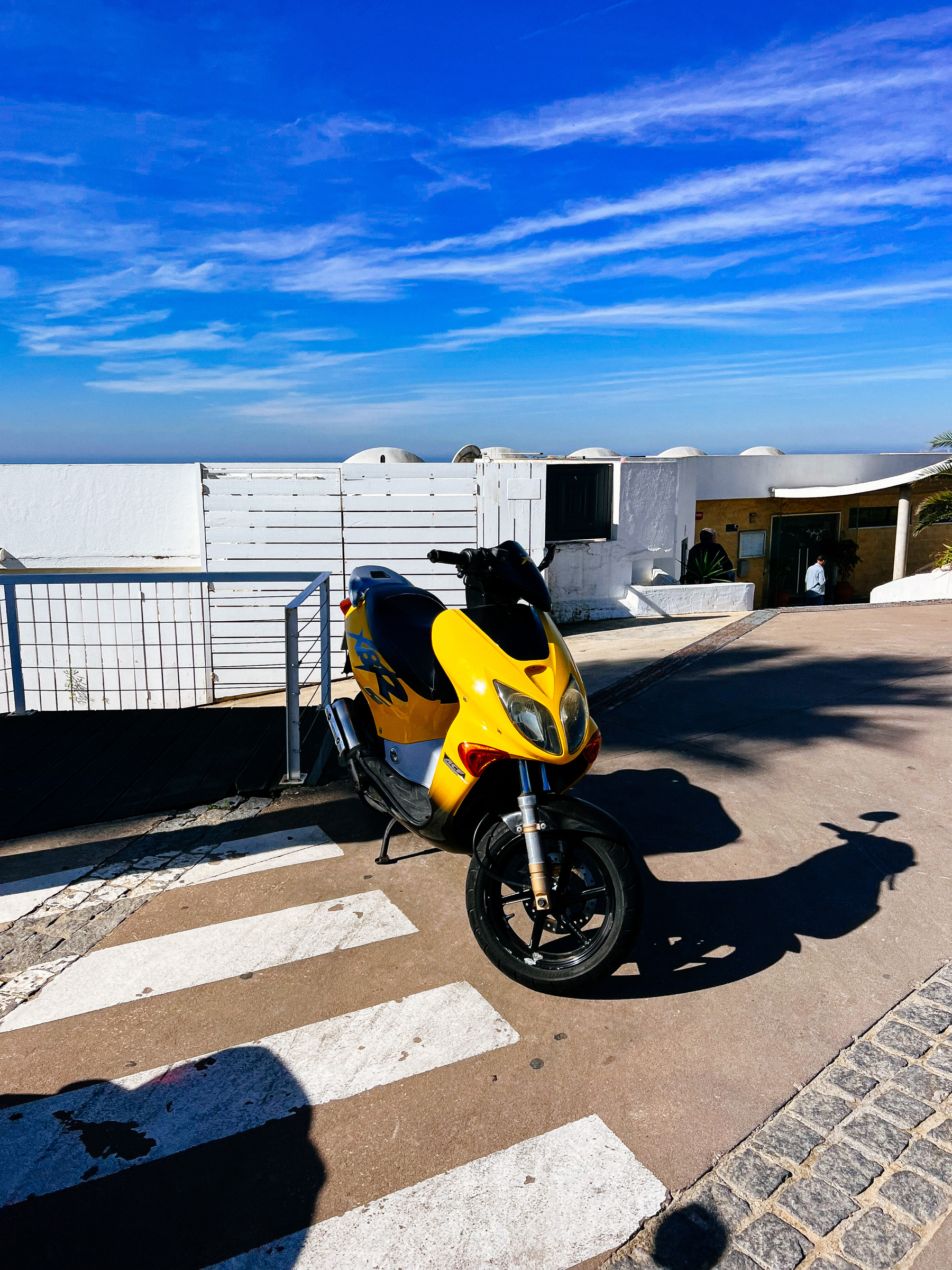 A yellow moped 