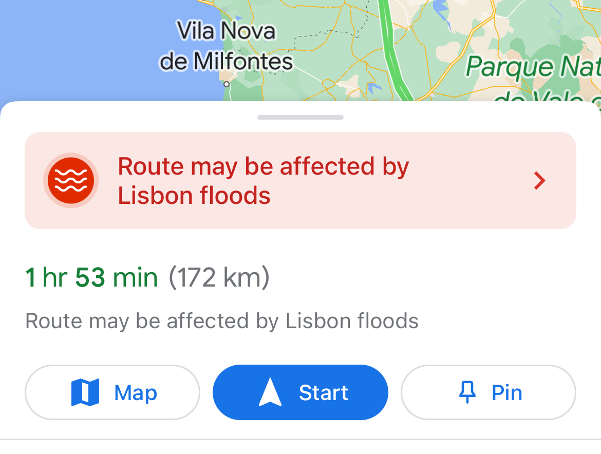 Google Maps screenshot with a warning, “Route may be affected by Lisbon floods”. 