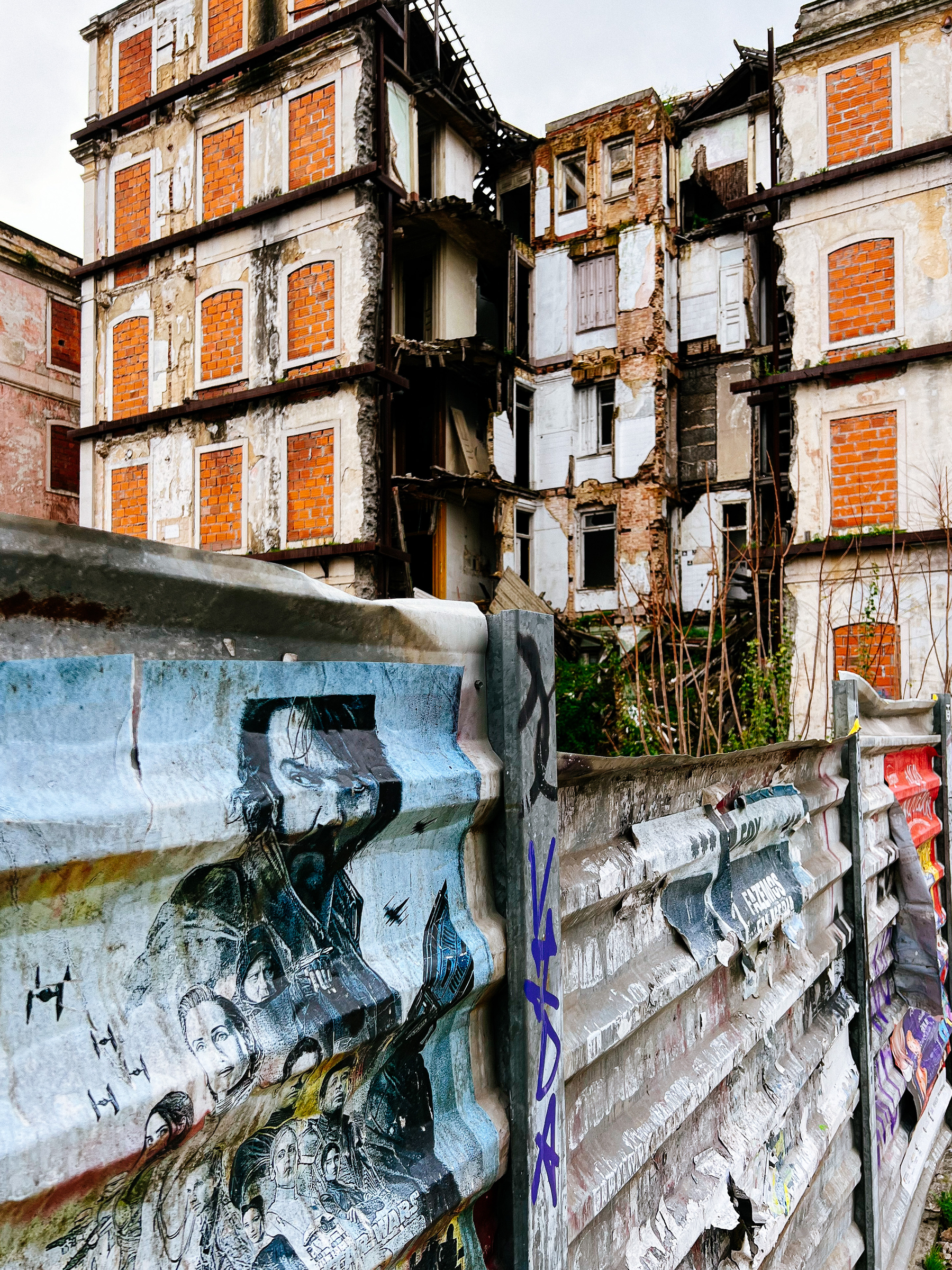The back of a derelict building, crumbling. 