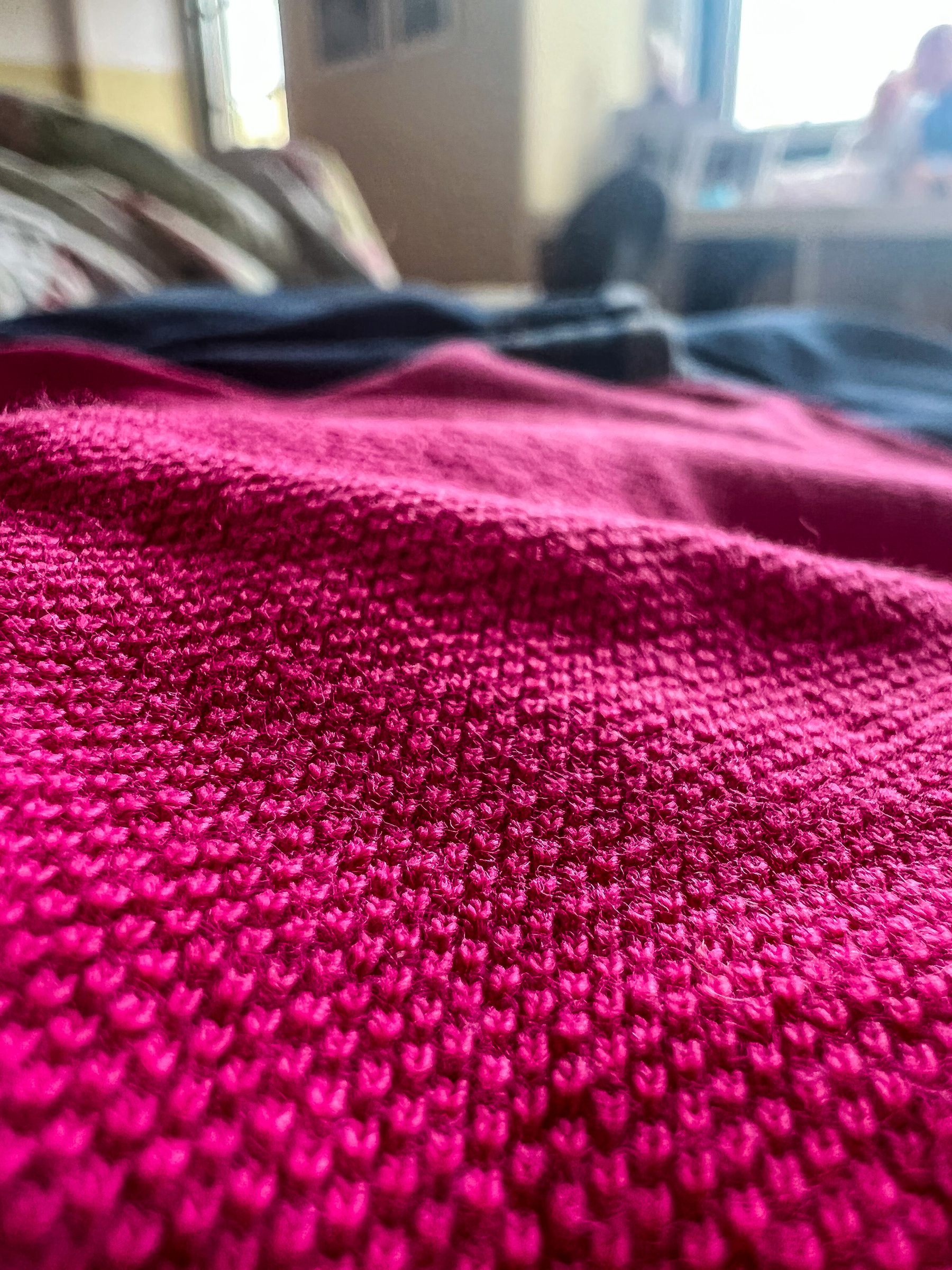 A close up of a pink polo shirt. 