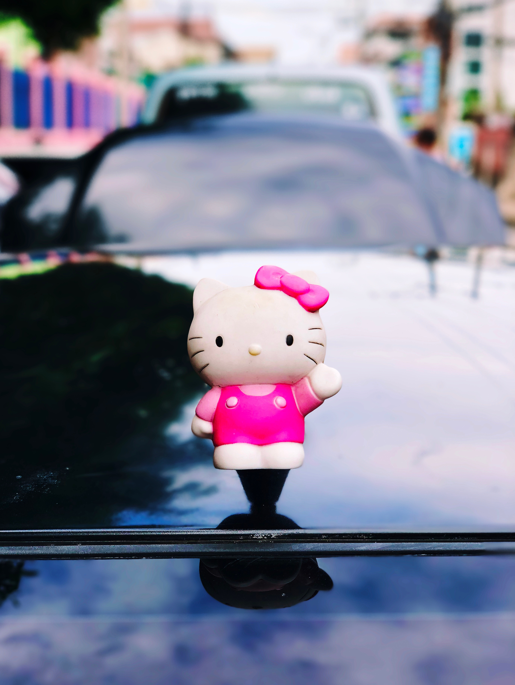 Hello Kitty toy as a hood ornament. 