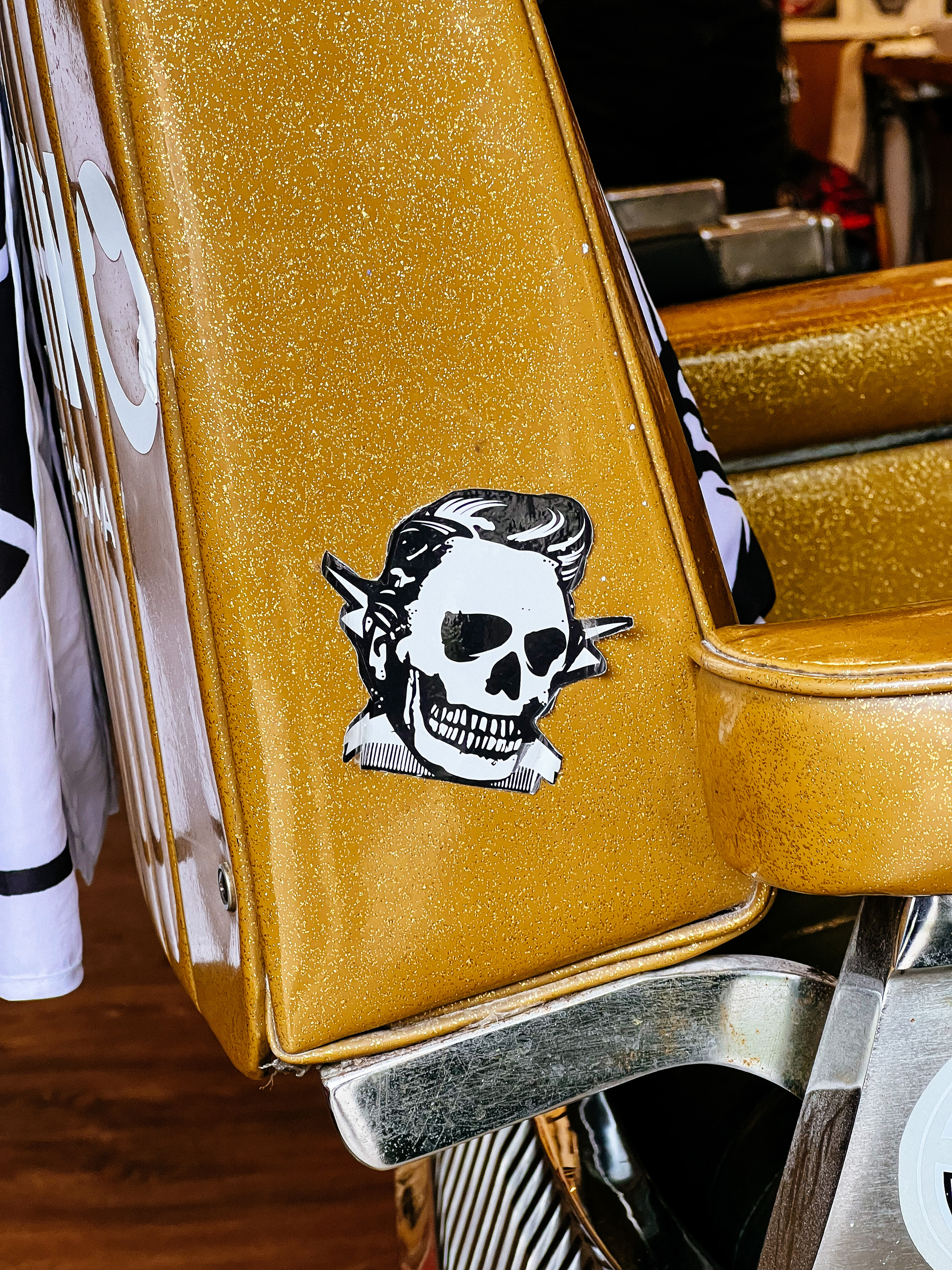 A skull sticker on a barber chair 