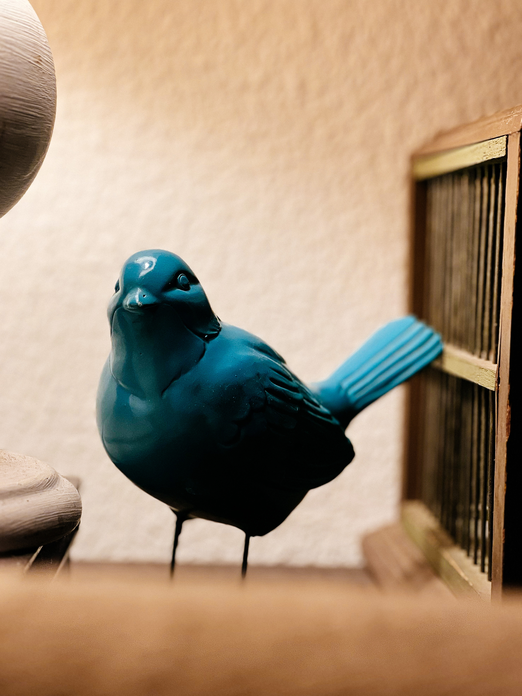 A blue ceramic bird.